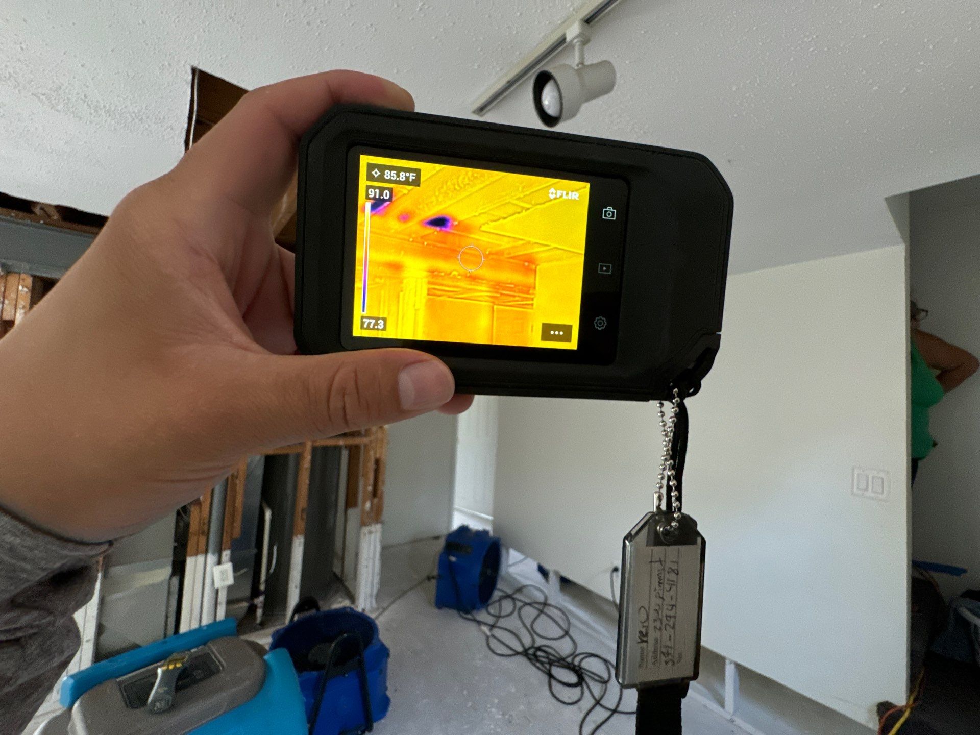 Thermal imaging reveals moisture distribution across framing during Sterling water damage assessment.