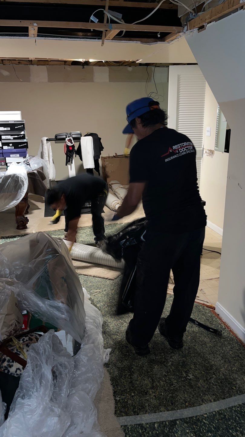 Standing water extraction underway in Annandale water damage restoration, removal of pooled water from flooring.