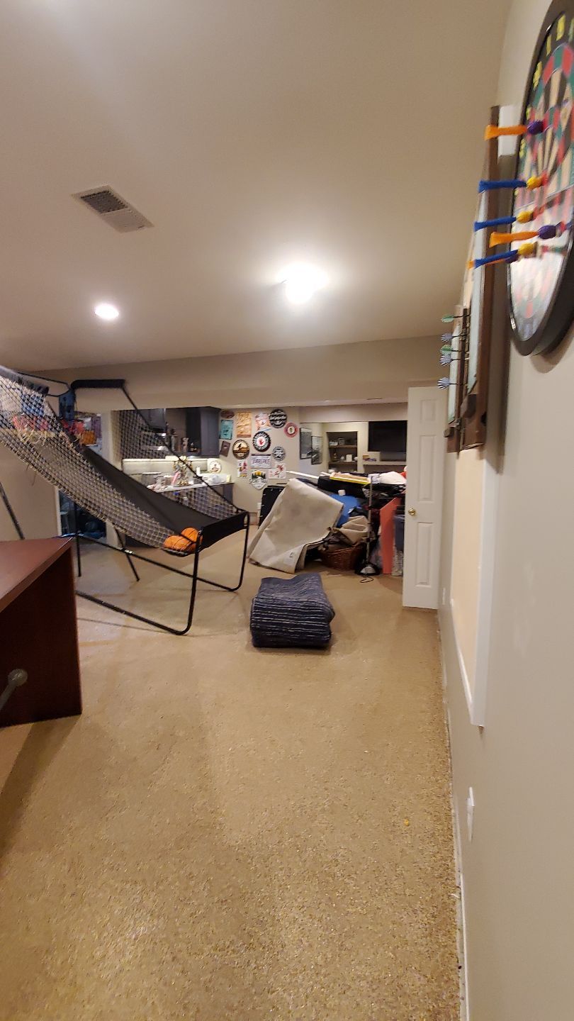 Mid-stage drying setup showing dehumidifiers and air movers working to extract moisture from affected areas.