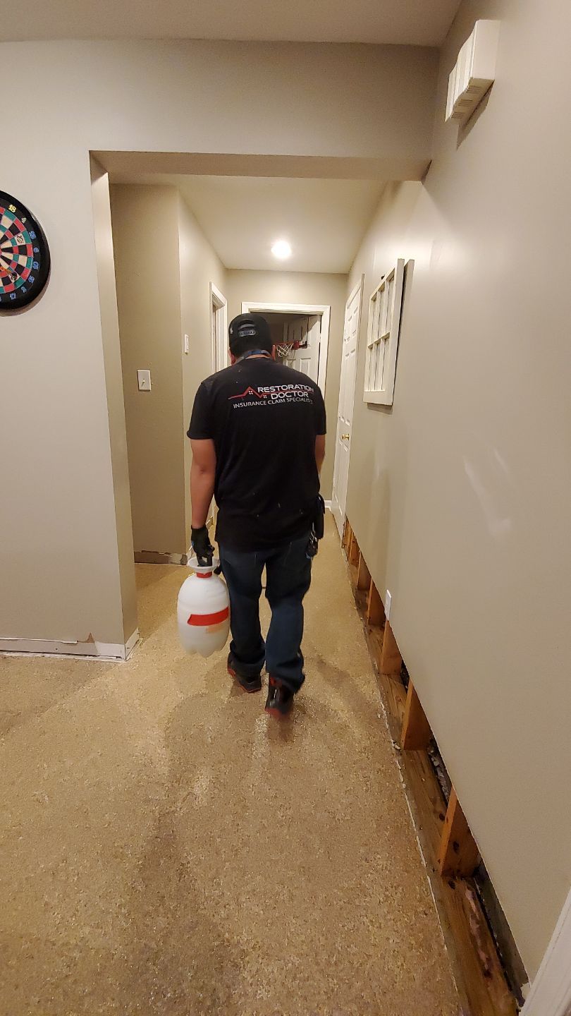 Continued dehumidification and structural drying process with equipment monitoring moisture levels in flooring.
