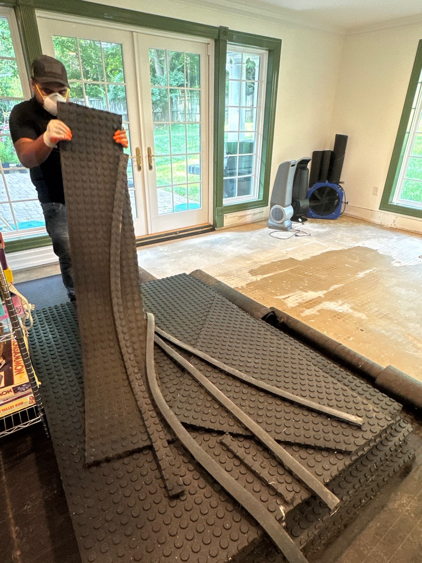 Flooring removal and substrate preparation during water damage restoration in McLean.
