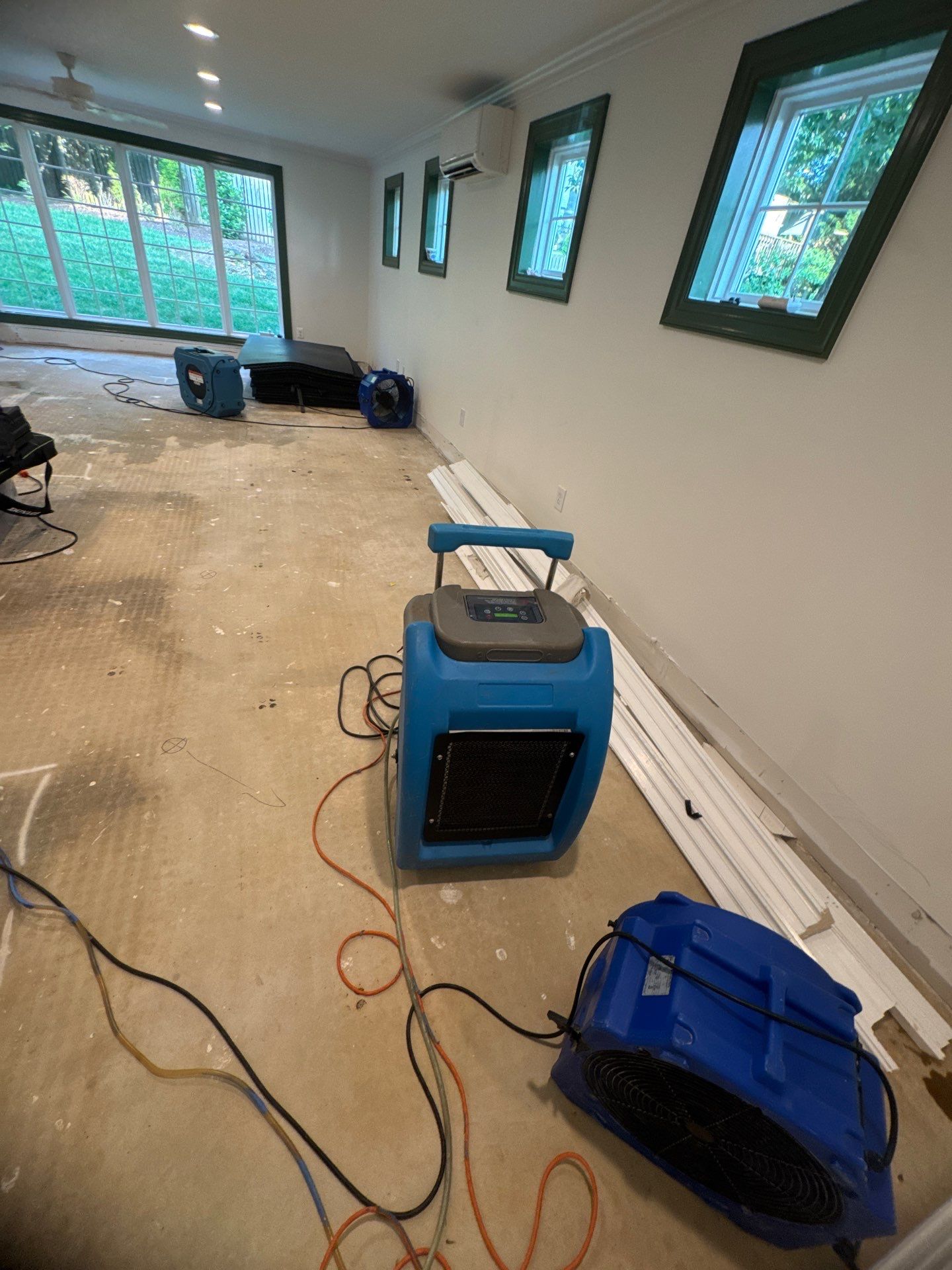 Drying equipment positioned throughout affected area during water damage restoration in McLean.