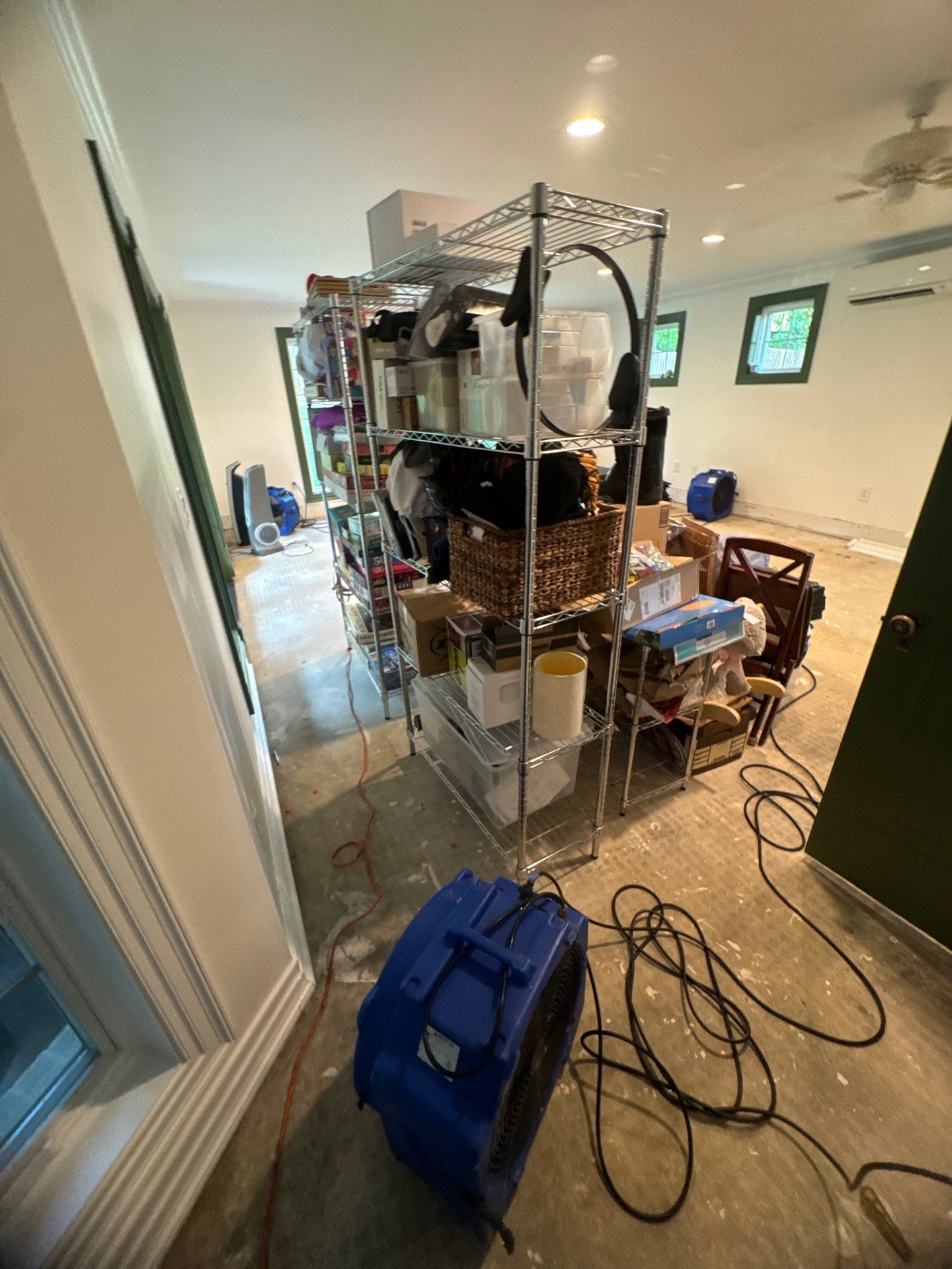 Mid-stage drying phase showing dehumidification setup for water damage restoration in McLean.