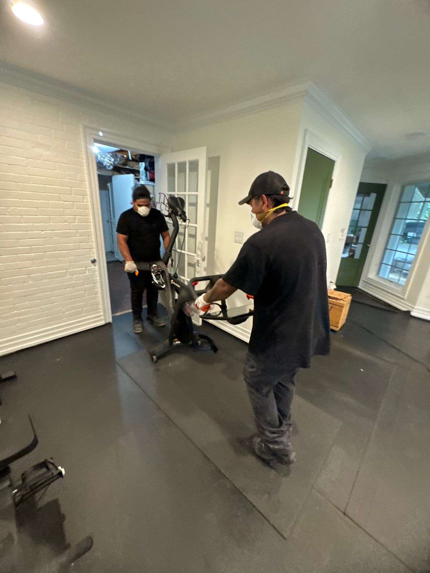 Water damage restoration in McLean: wet flooring and carpet requiring removal and structural drying.