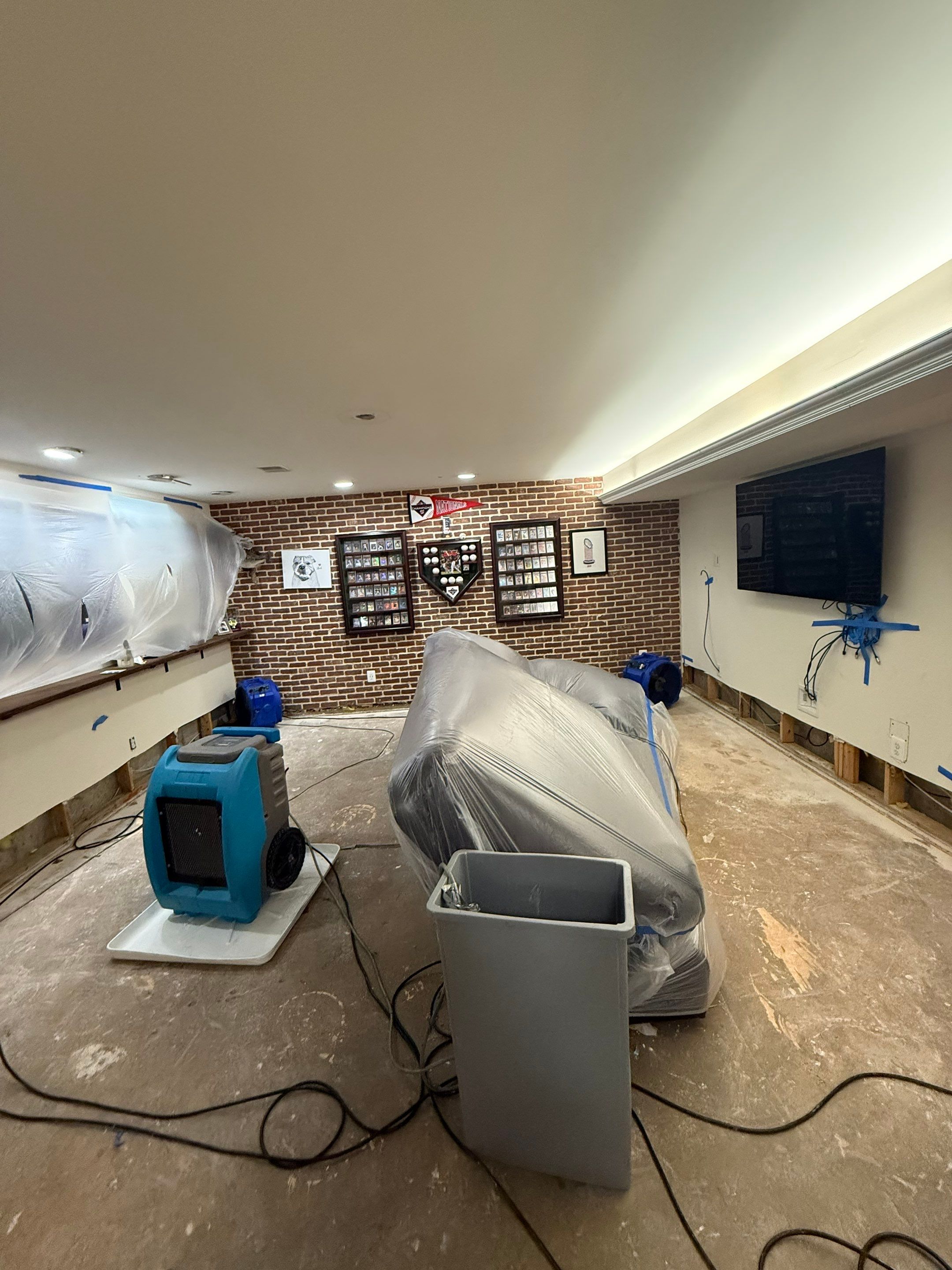 Structural drying equipment positioned to remove residual moisture from affected areas.