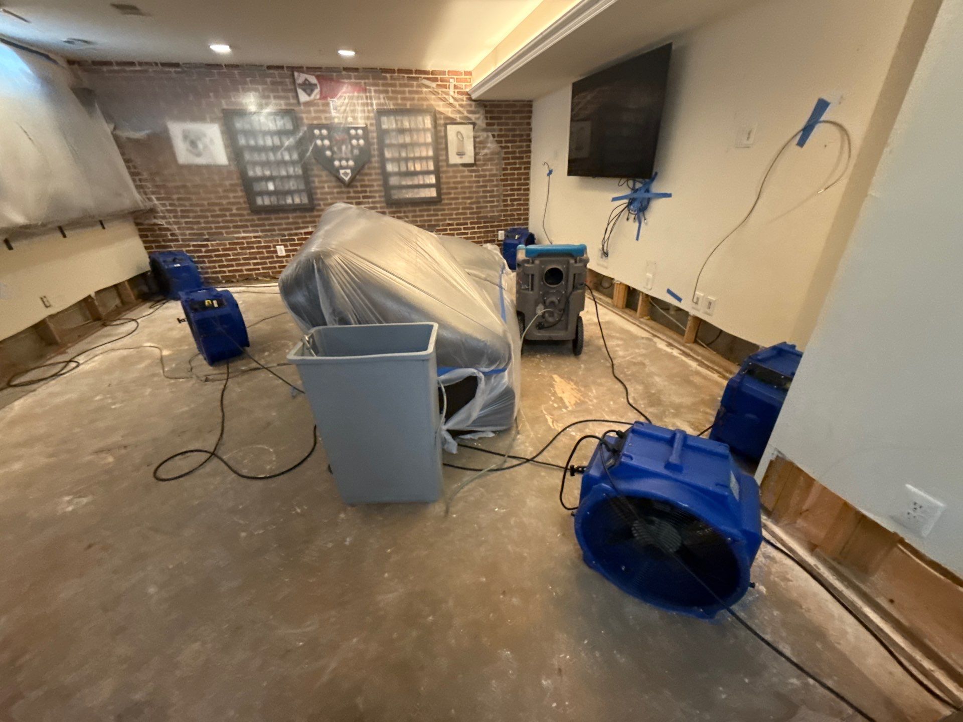 Continued drying and moisture monitoring in remediation workflow.