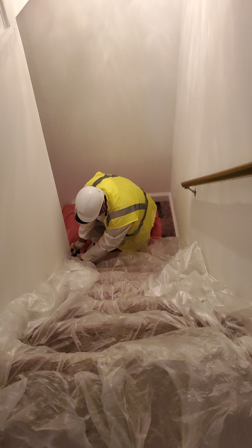 Carpet removal and subflooring inspection as part of water damage remediation.