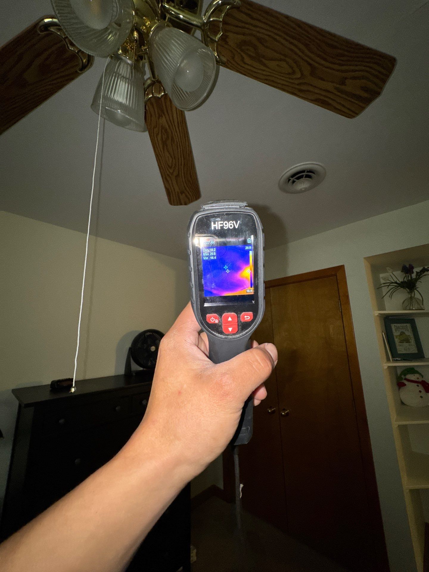 Structural drying equipment positioned to remove residual moisture from affected ceiling assembly.