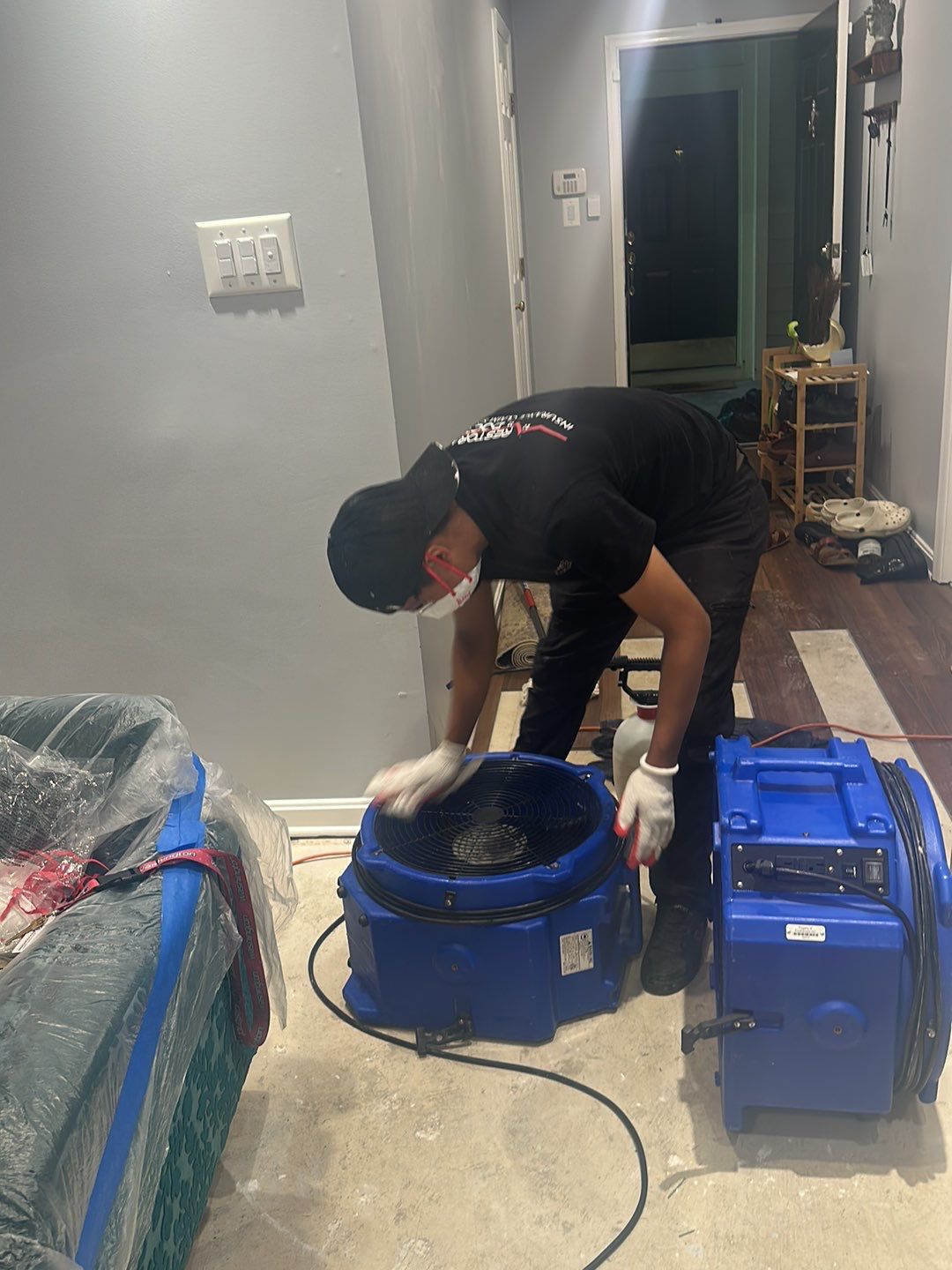 Standing water extraction and dehumidification equipment deployed during mold remediation in Gaithersburg.