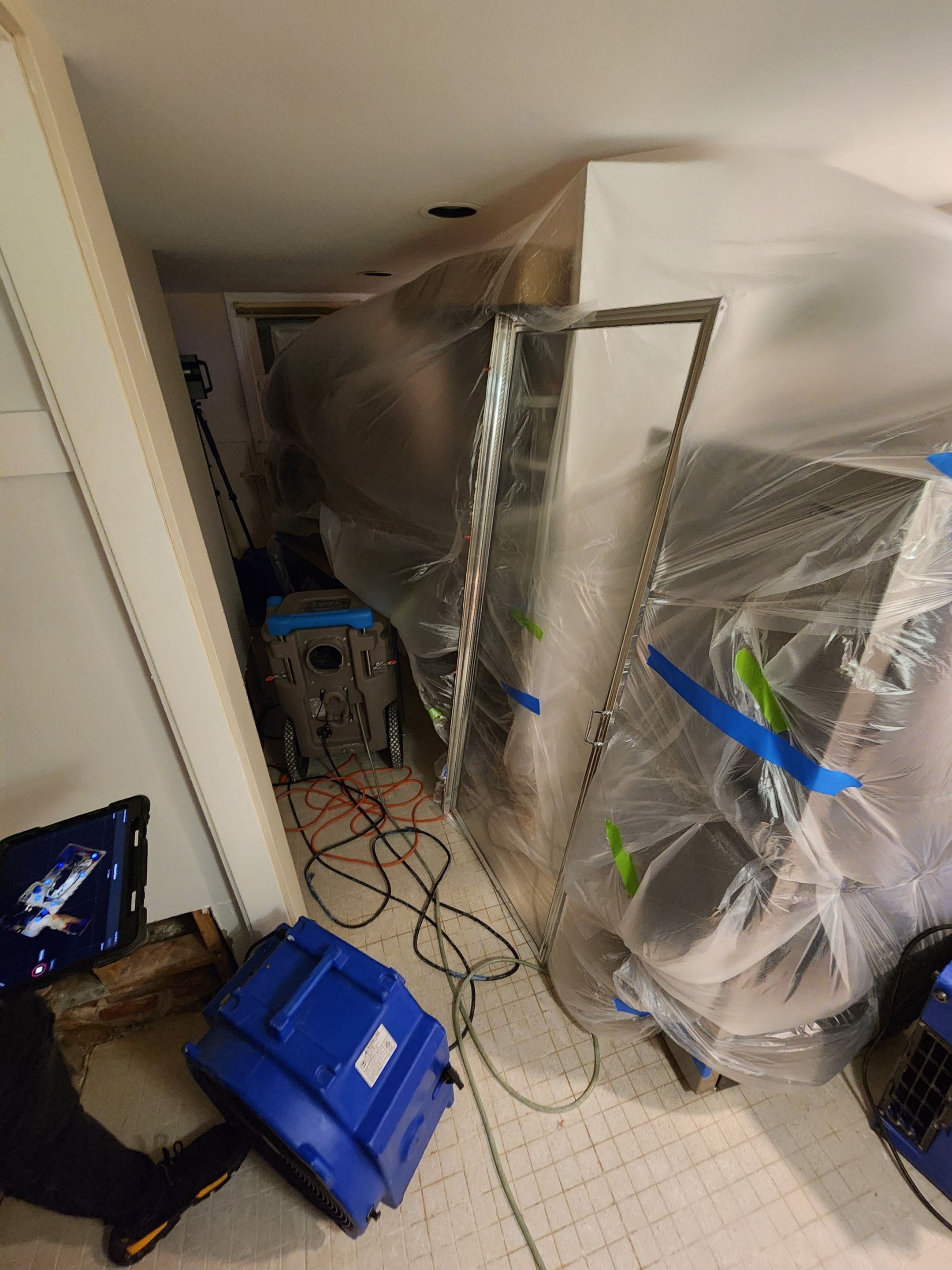 Moisture monitoring and continued drying phase of Washington water damage restoration project.