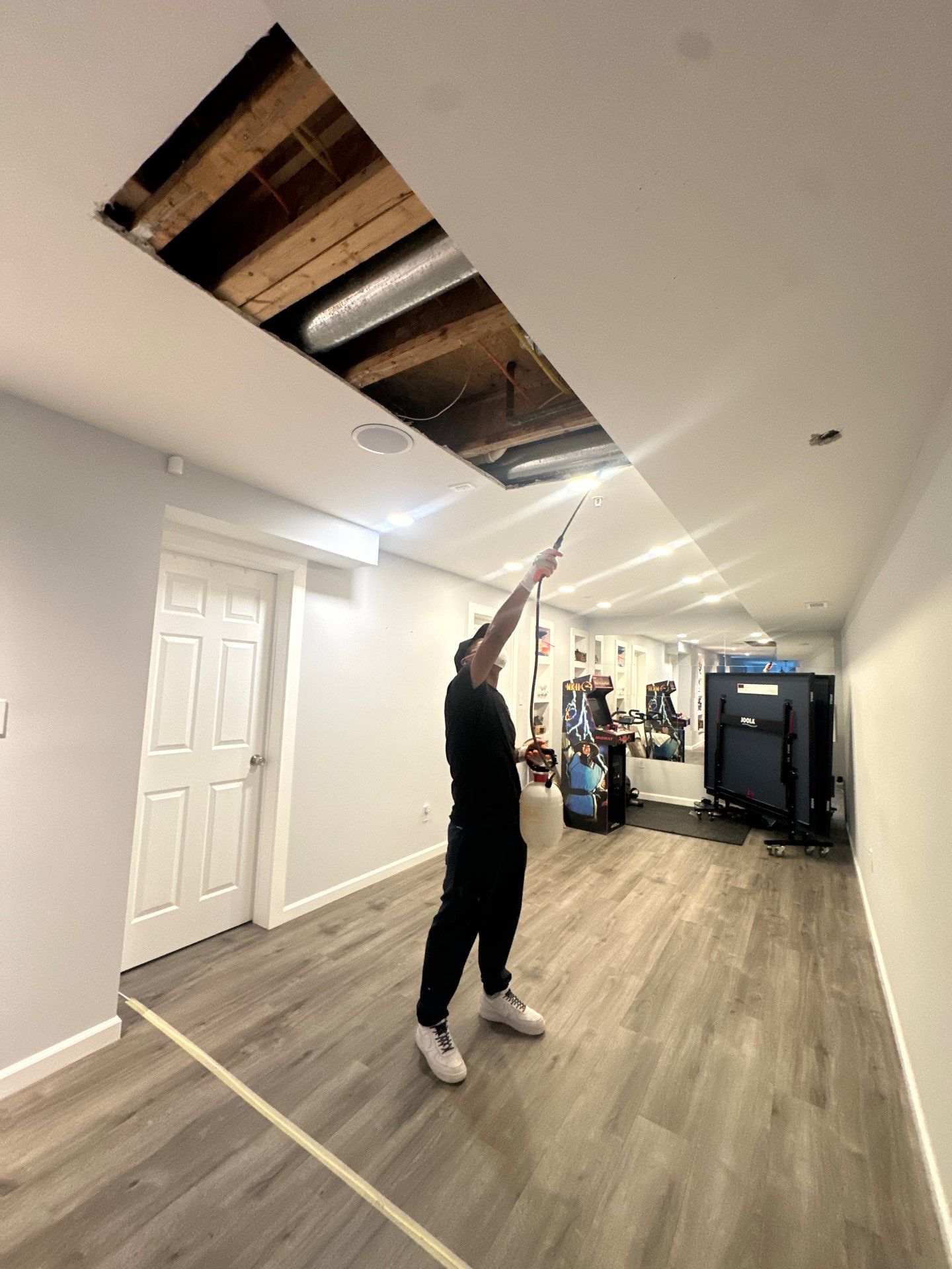 Dehumidifiers and air movers positioned during water damage drying phase in Washington.