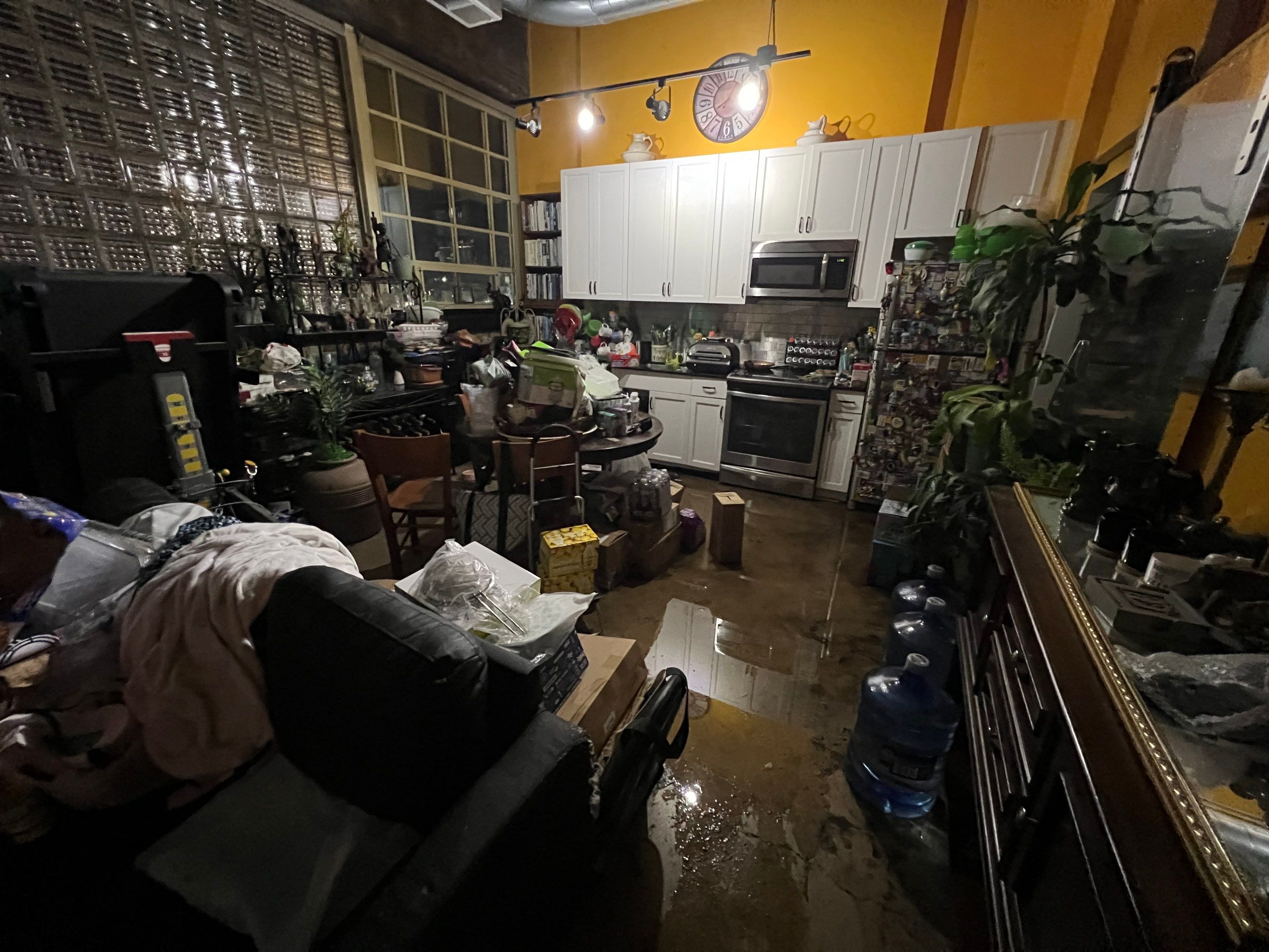 Standing water extraction and dehumidification equipment deployed during water damage restoration in Washington.