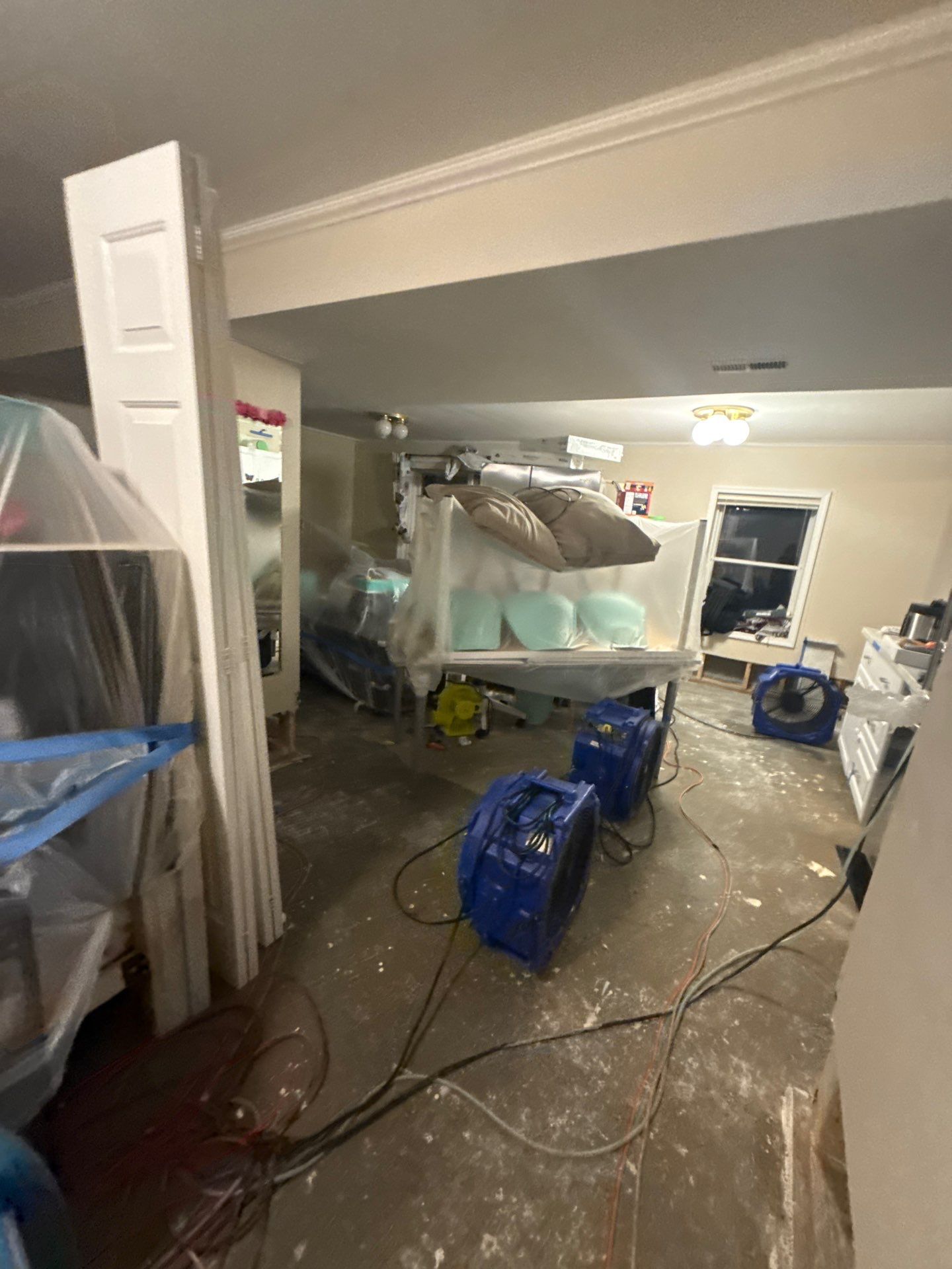Structural drying equipment positioned to remove residual moisture from affected areas.