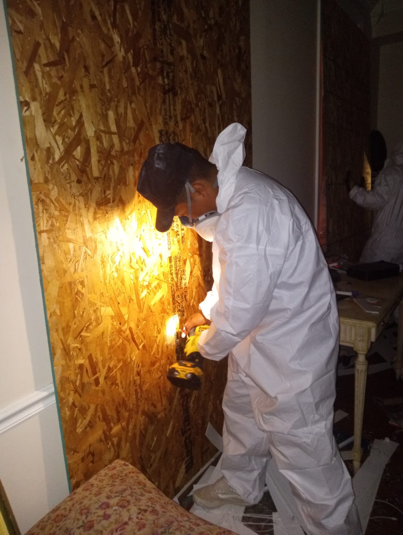 Continued drying operations with monitoring equipment tracking moisture levels in structural materials.