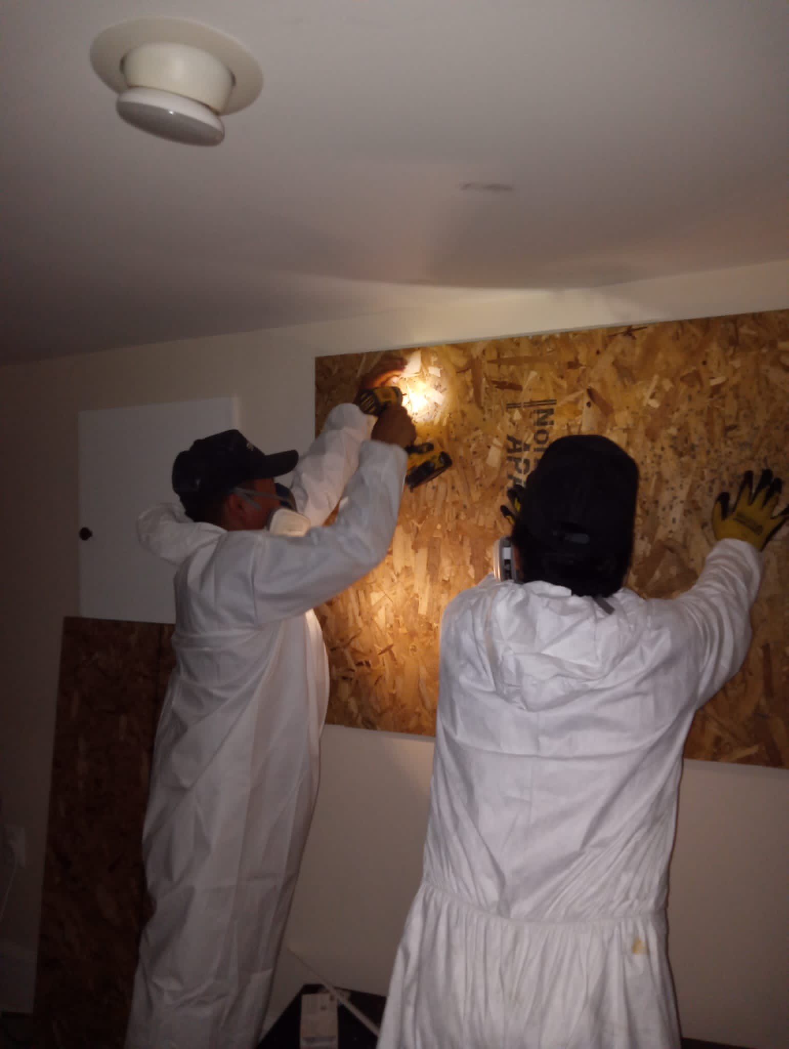 Ceiling damage assessment and preparation for repair following water extraction and drying phases.