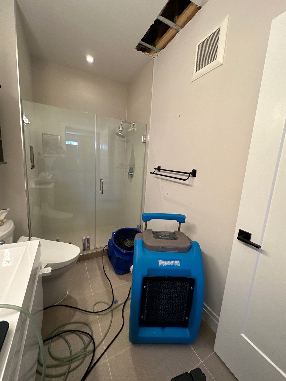 Containment barrier and negative air setup for mold remediation phase of water damage restoration.