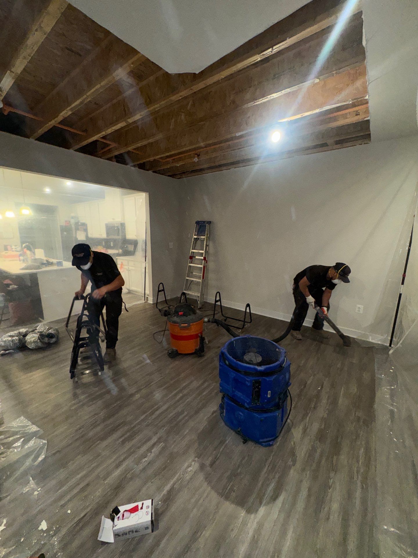 Continued drying and containment maintenance through mid-stage remediation work.