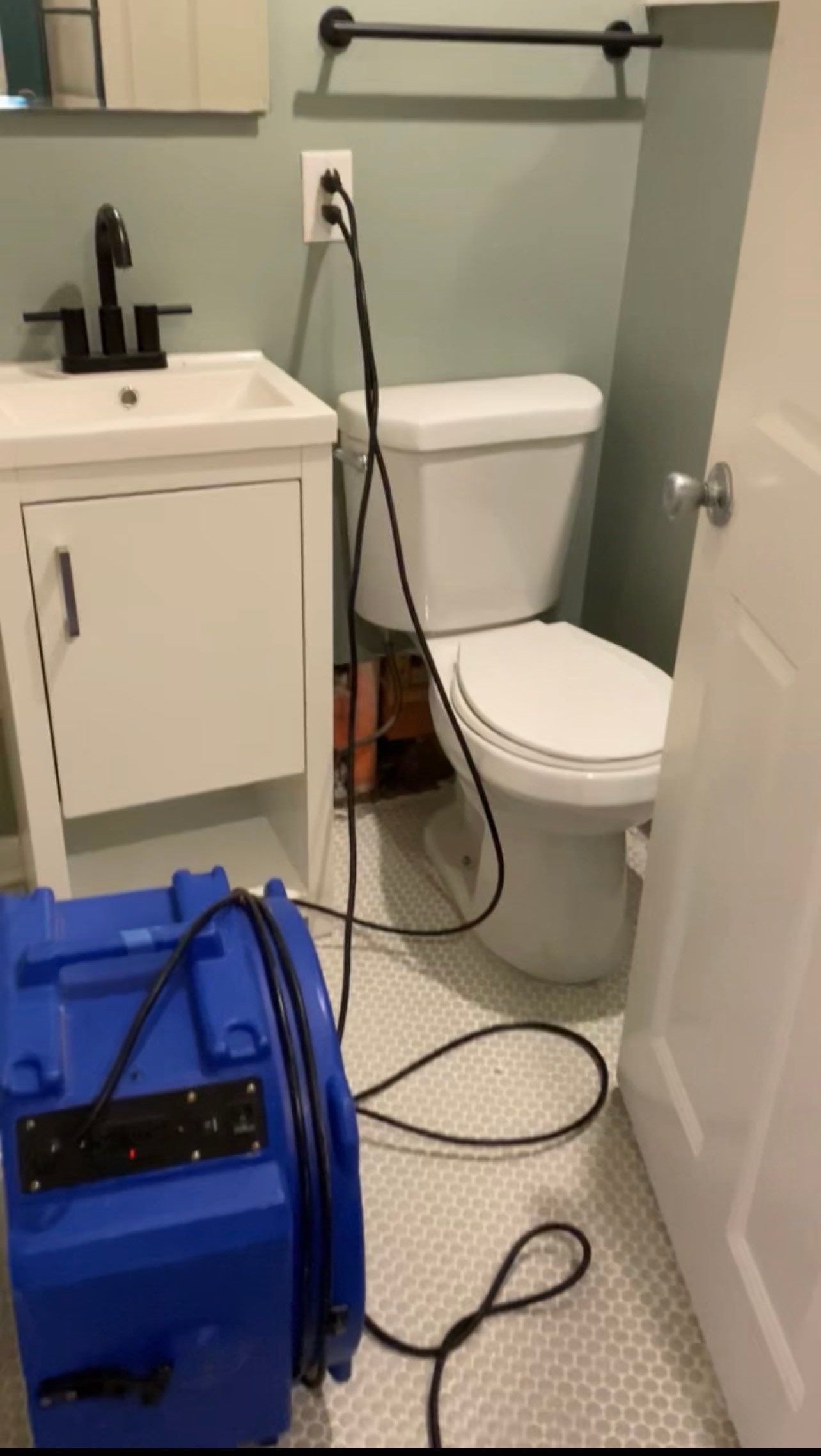 Containment barrier and extraction equipment set up during water damage restoration in Washington.