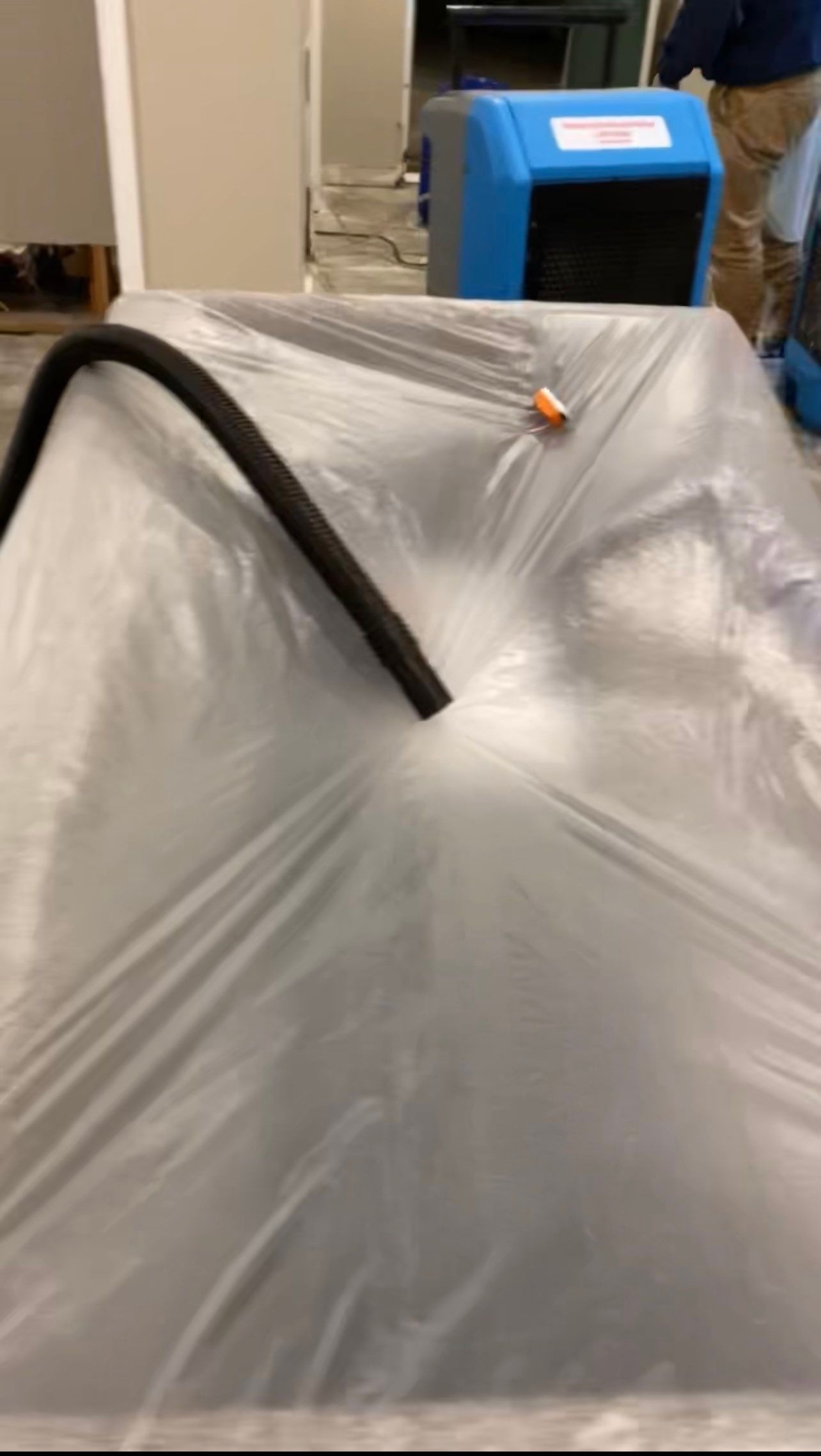 Dehumidification units positioned to dry affected areas after water extraction in Washington.