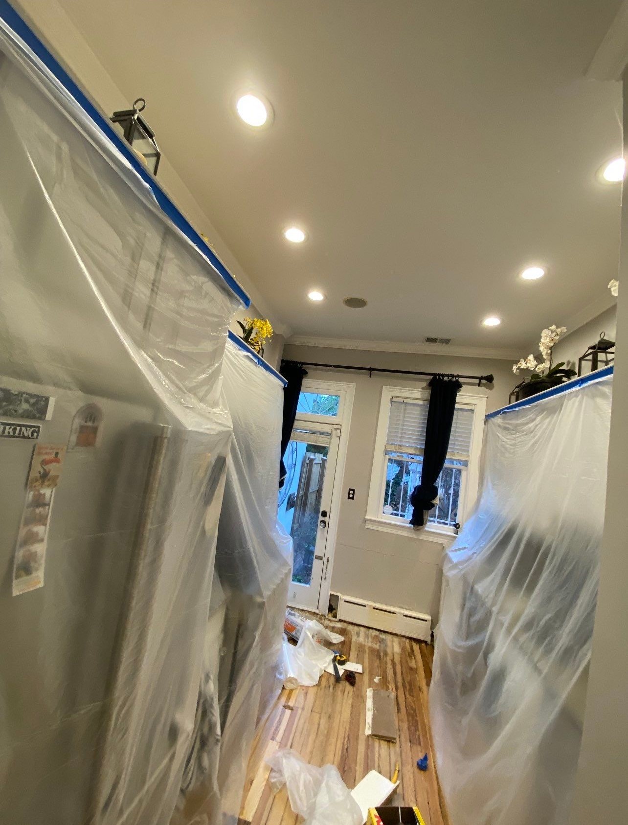 Continued dehumidification setup with multiple units managing moisture removal from building materials.