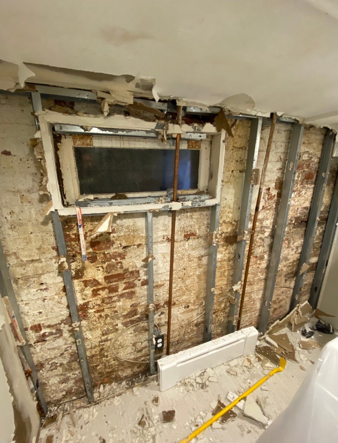 Final-stage water damage restoration in Washington showing cleared space and equipment removal after drying completion.