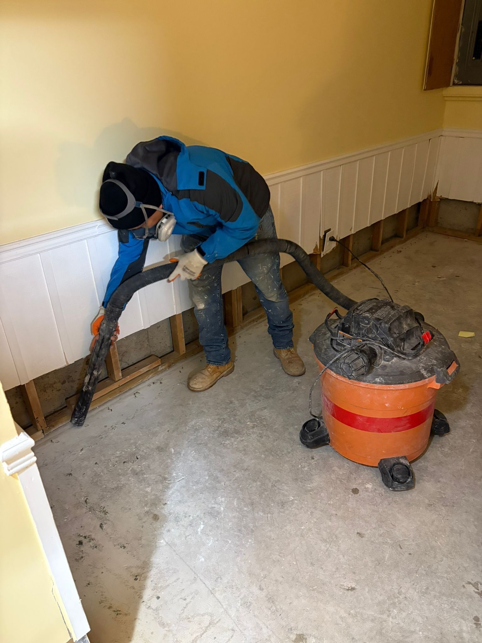 Mold remediation in Gaithersburg: structural drying equipment positioned to address moisture in wall cavity.