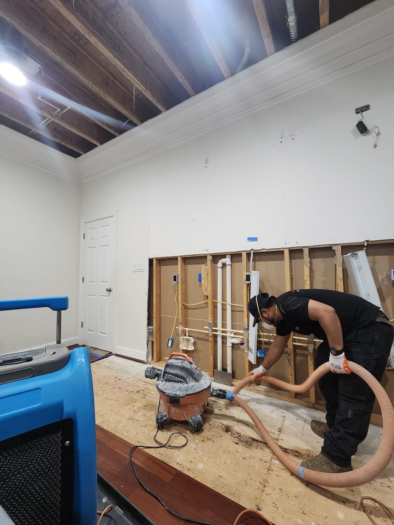 Moisture monitoring and drying progression during Marlboro mold remediation, ceiling damage assessment visible.
