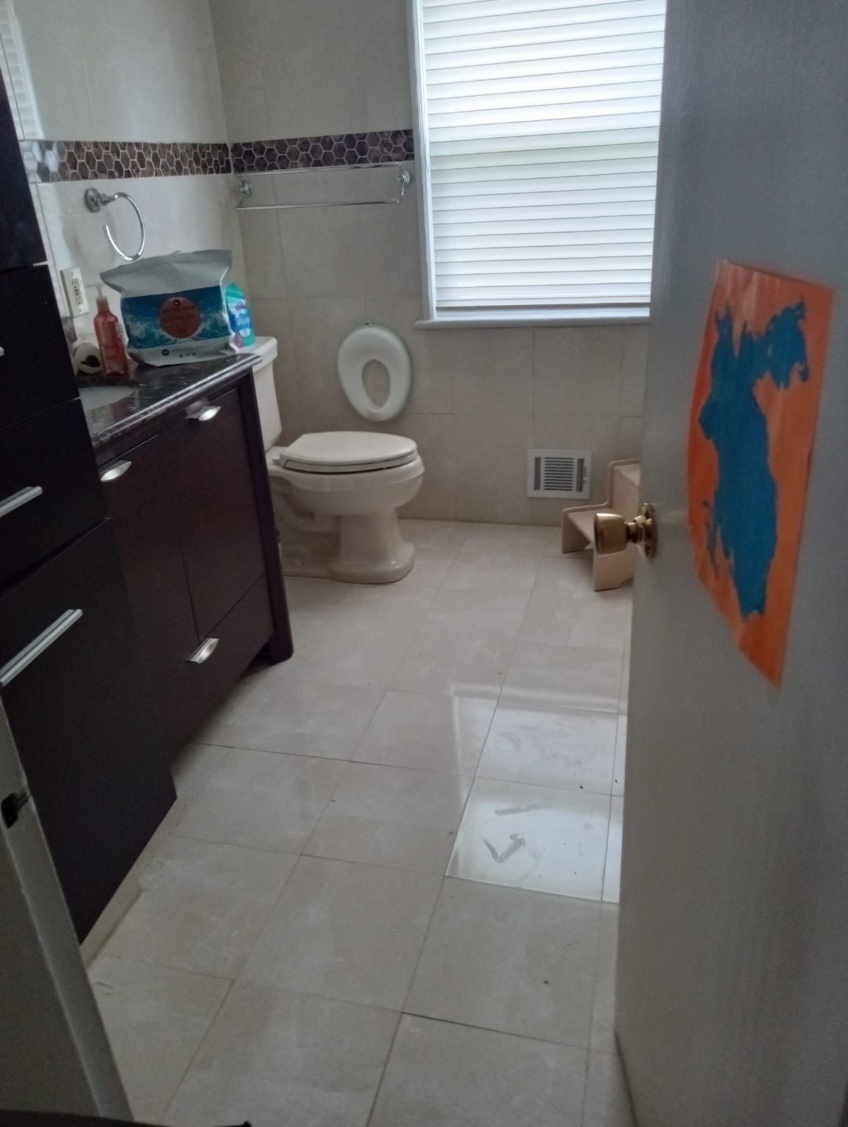 Wet carpet and padding removal in progress as part of water damage mitigation work.