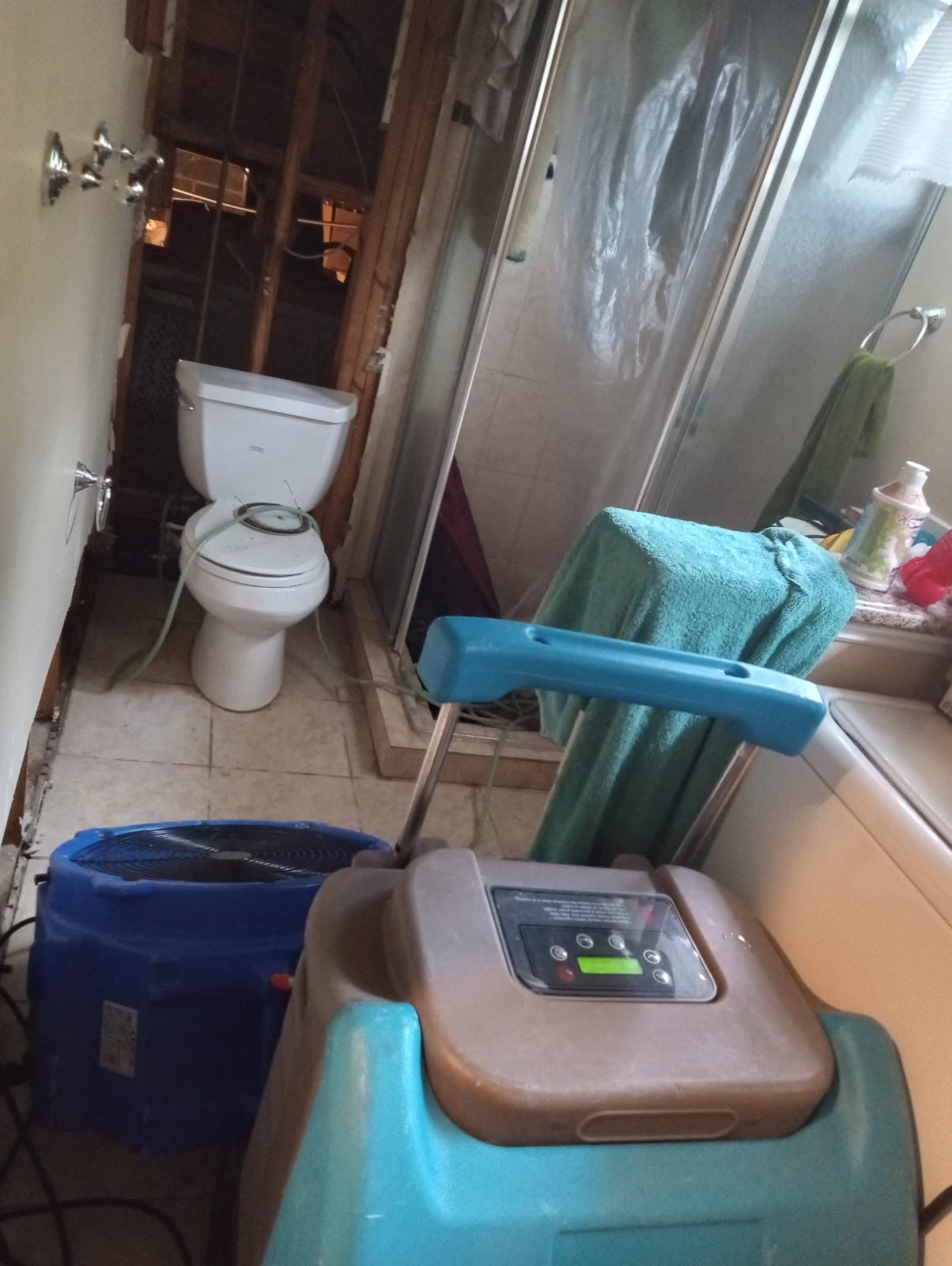 Standing water being extracted from flooded residential space during water damage restoration in Silver Spring.