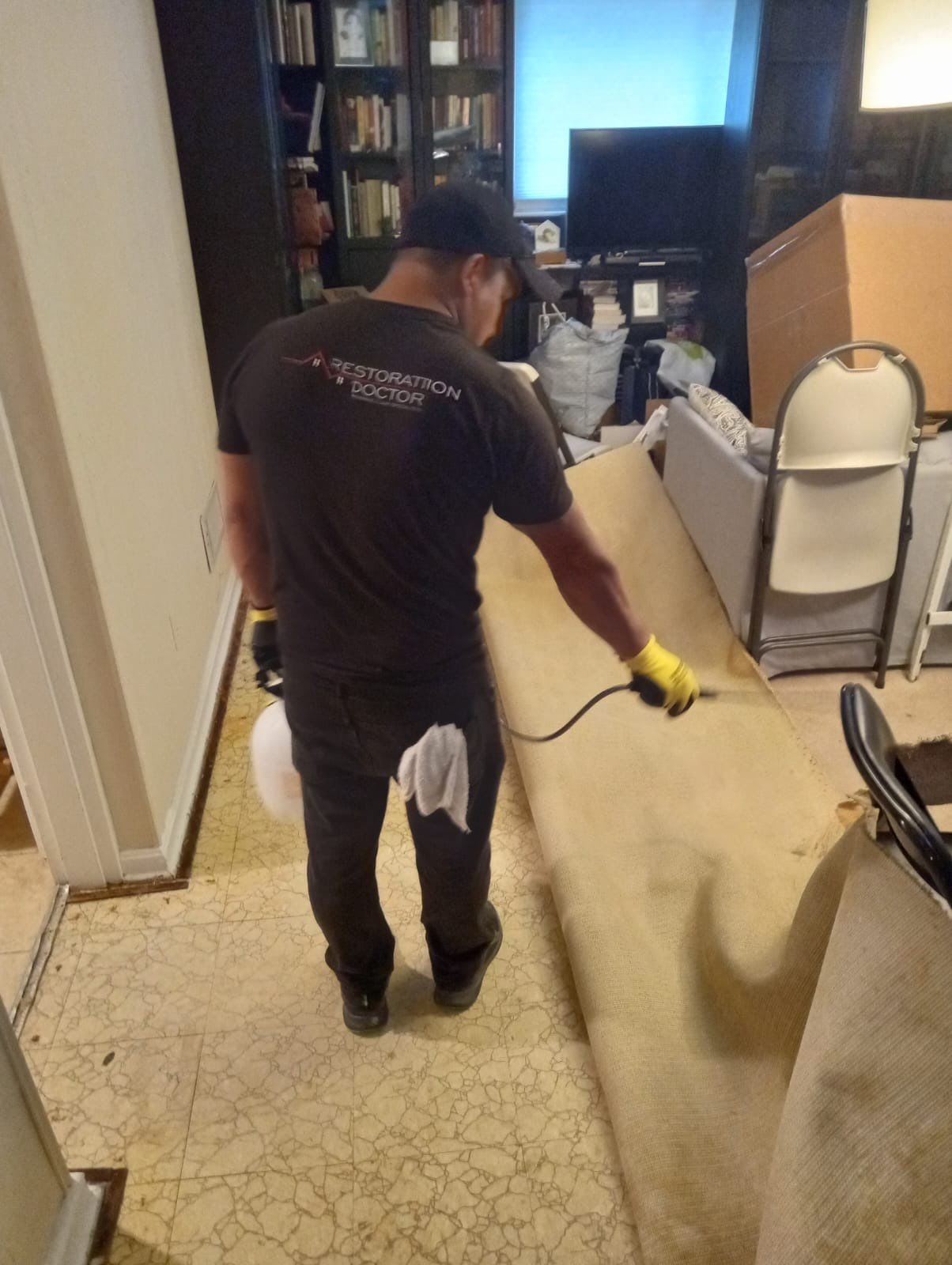 Structural drying equipment positioned throughout affected area to remove moisture from walls and subfloor.