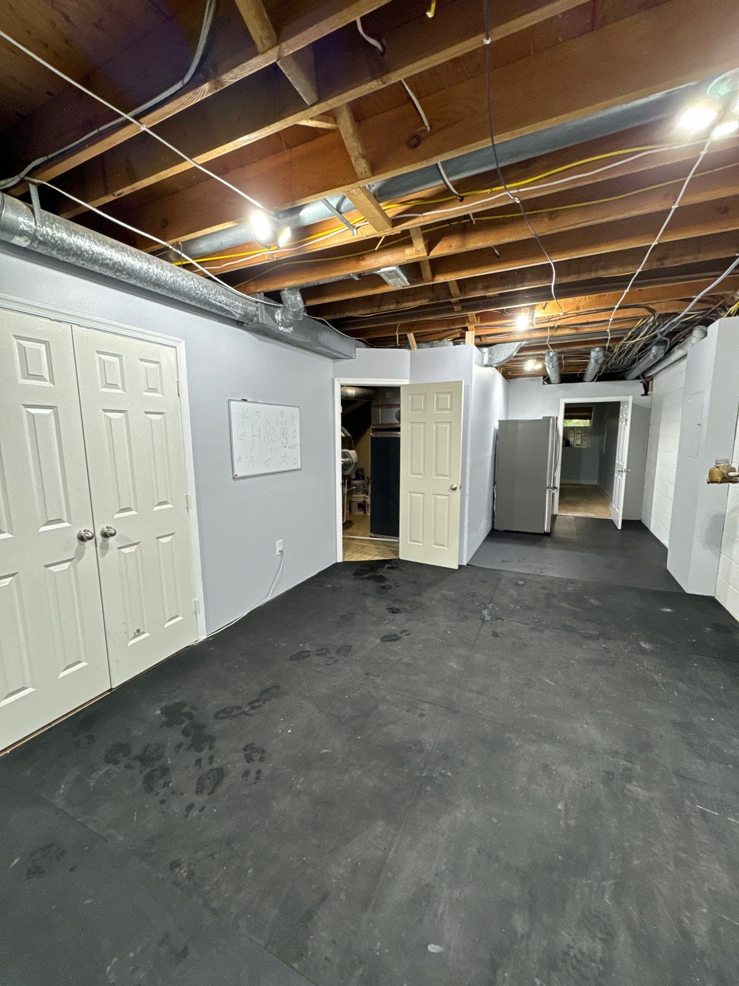 Structural drying phase with dehumidifiers and air movers positioned throughout affected areas.