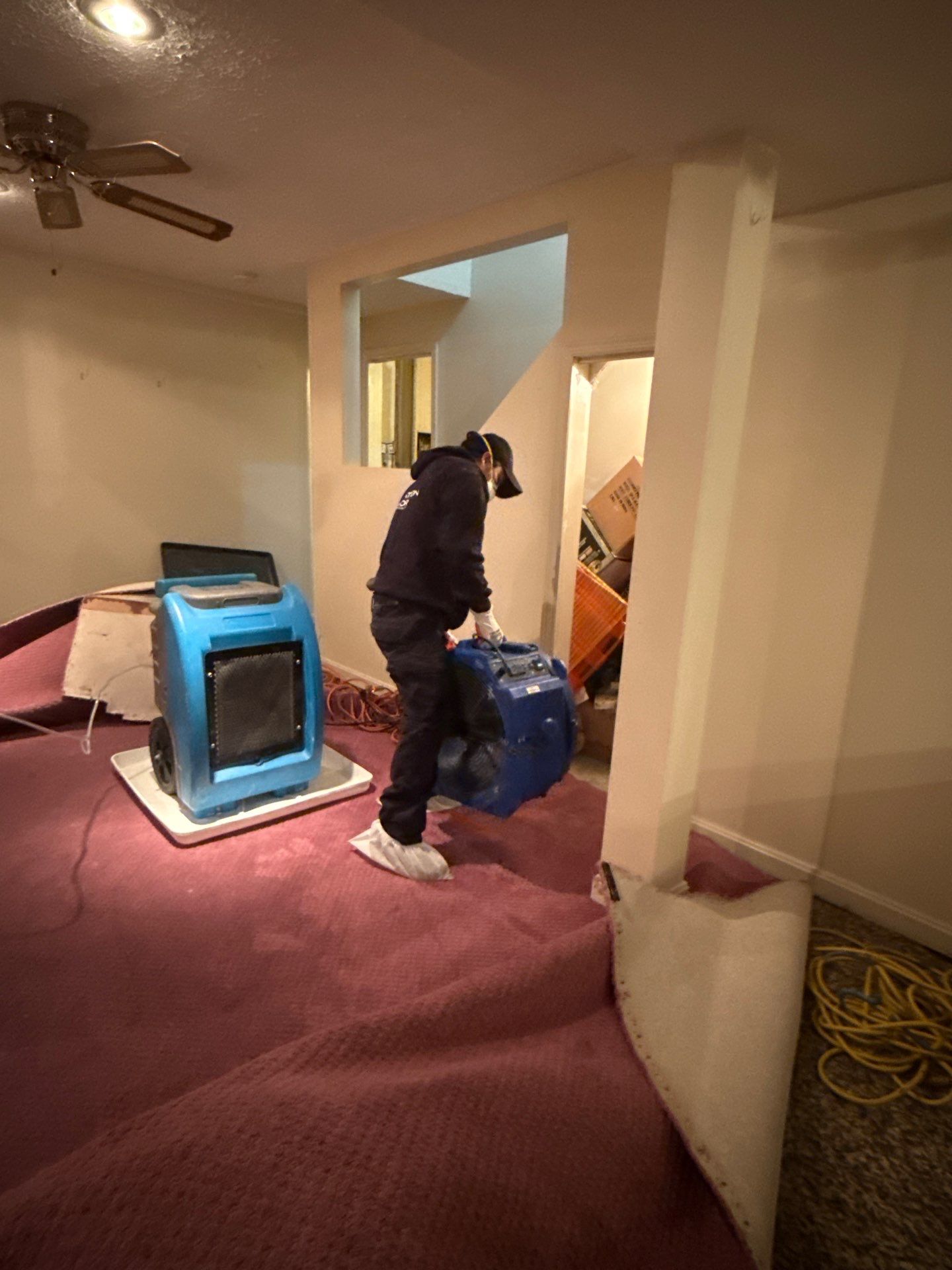 Flooring demolition and debris removal as part of water damage restoration scope.