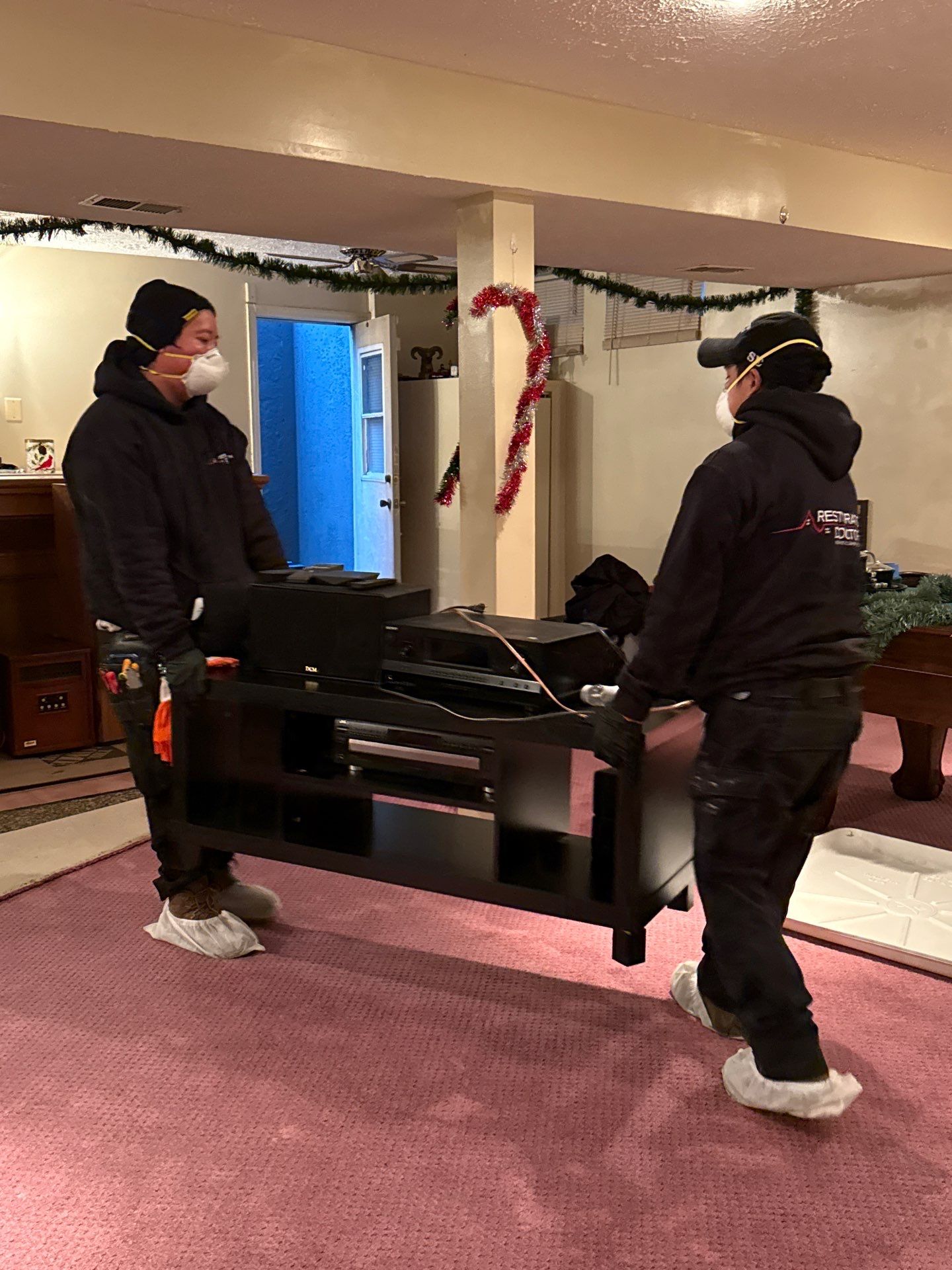Structural materials exposed and drying following water extraction and carpet remediation.