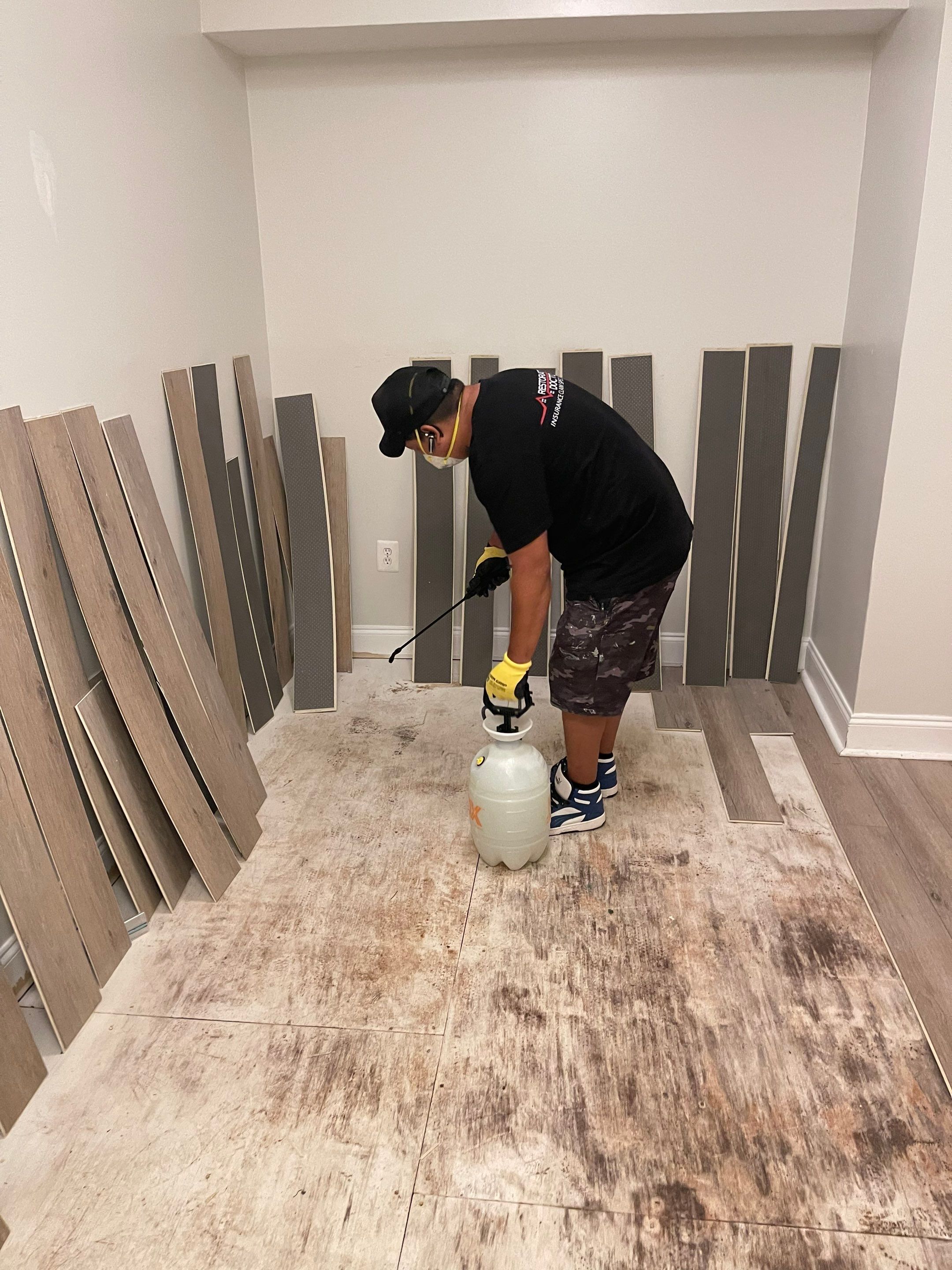 Flooring remediation continuing, extractors and dehumidifiers positioned for drying in Washington.
