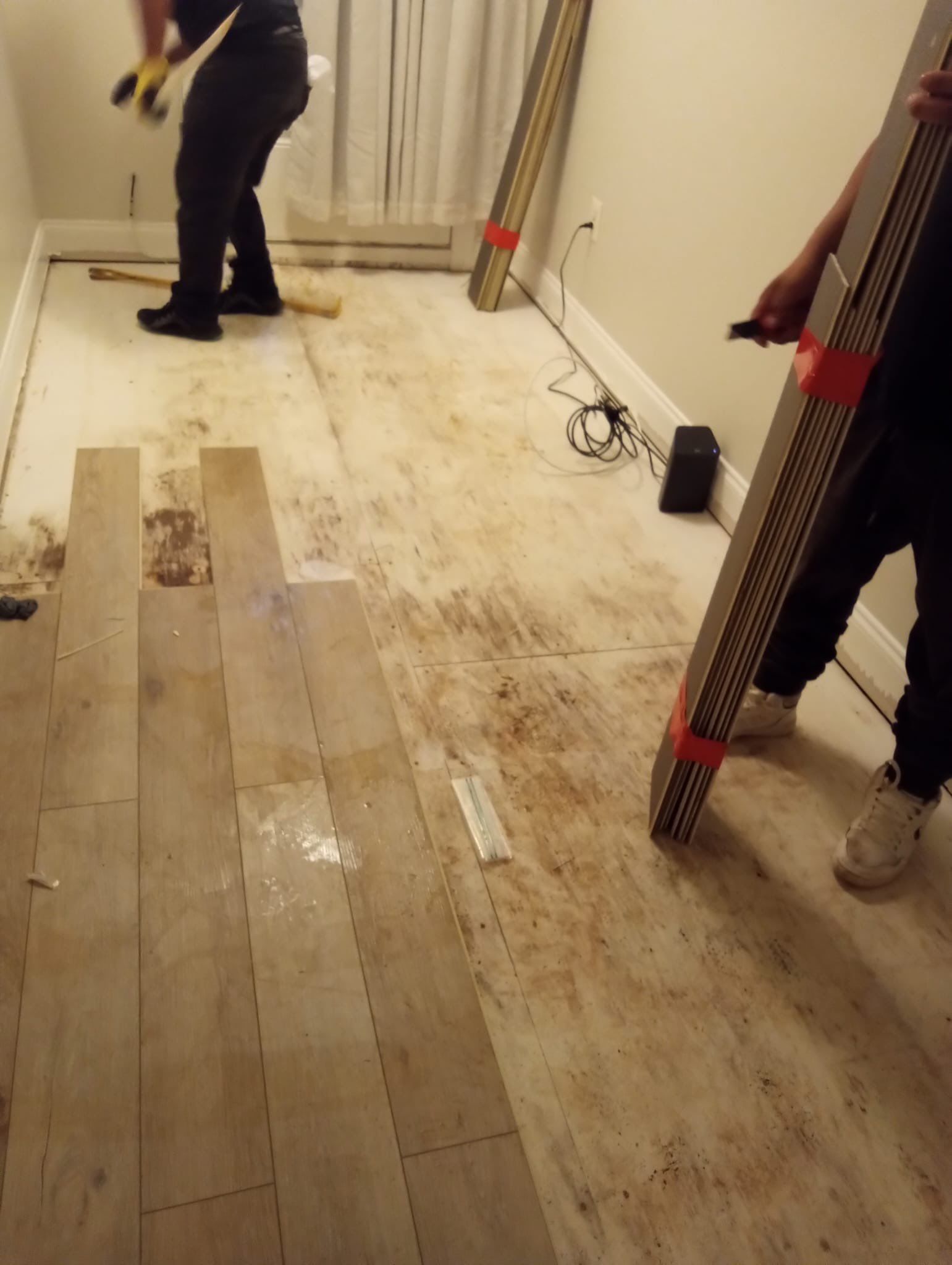 Sanitizing application to affected surfaces following water extraction and carpet removal.