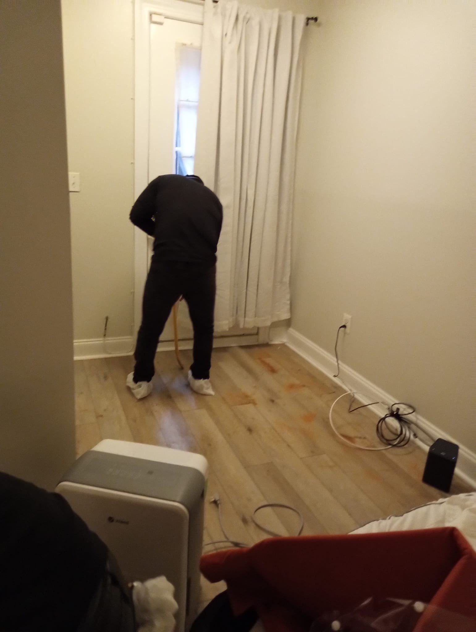 Final stage of water damage restoration in Washington, flooring prepared for replacement.