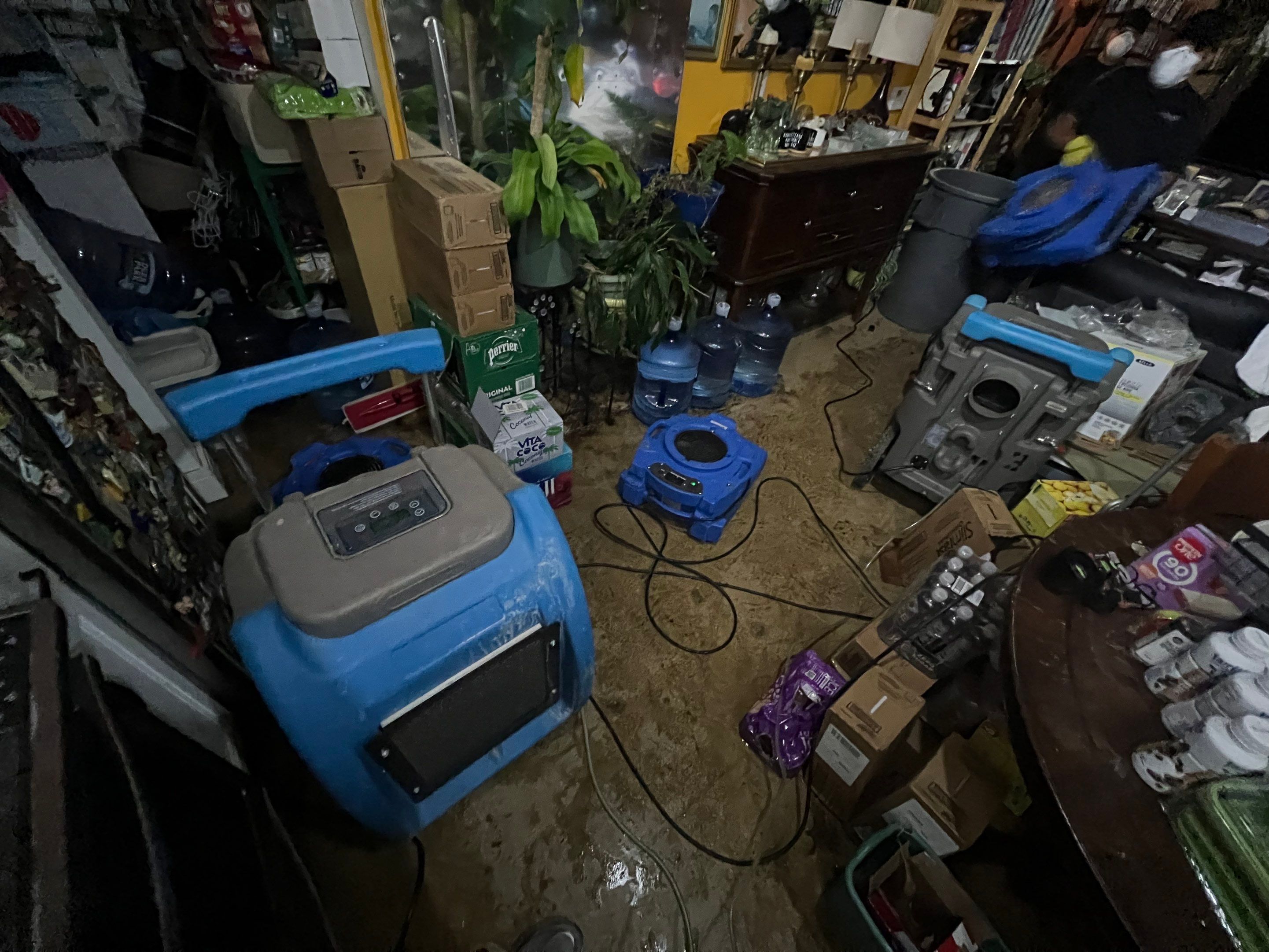 Standing water pooled across flooring during initial water damage assessment in Northeast.