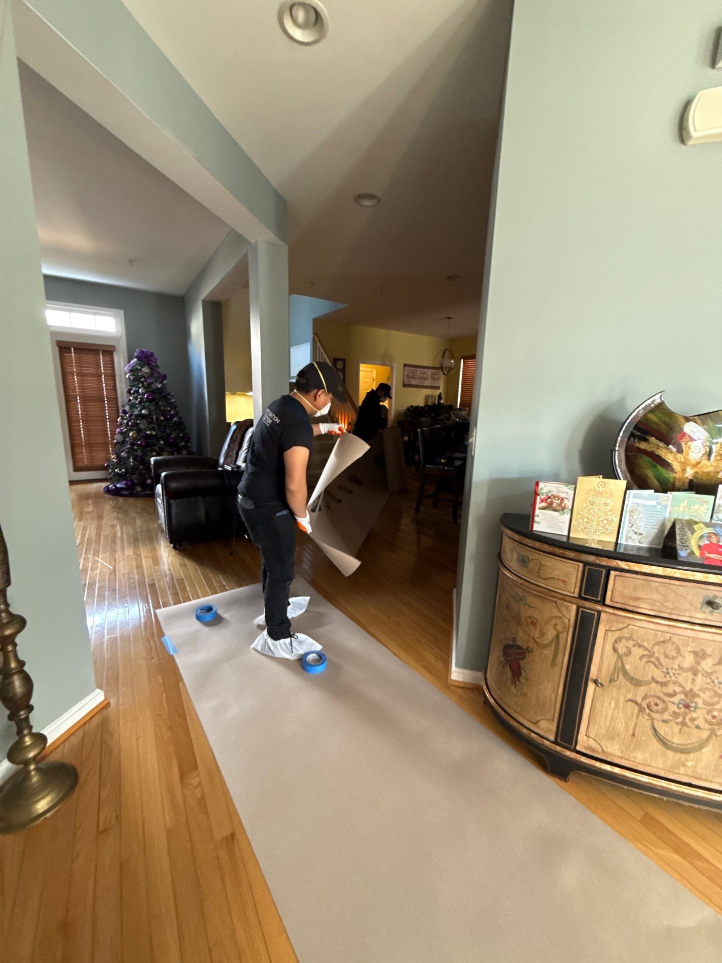 Baseboard removal underway during mold remediation work.