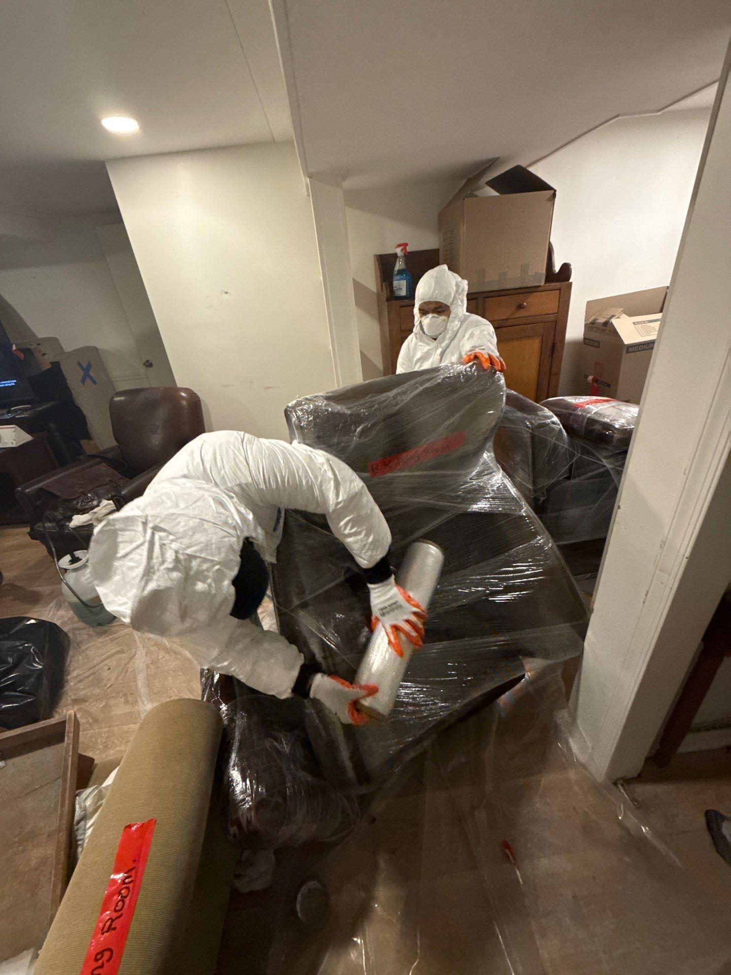 Sealed storage area maintaining protected household items during active water damage mitigation in Silver Spring.