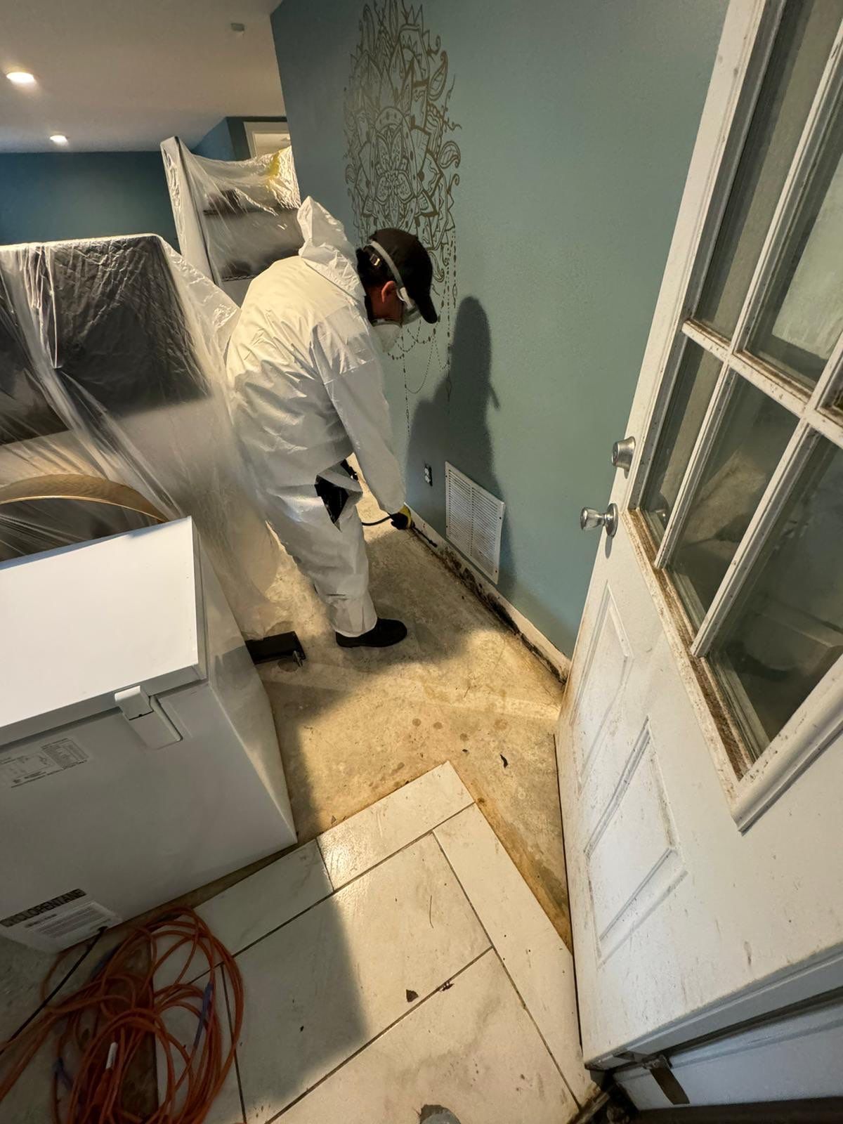 Ceiling damage assessment and preparation for repair after water extraction and drying.