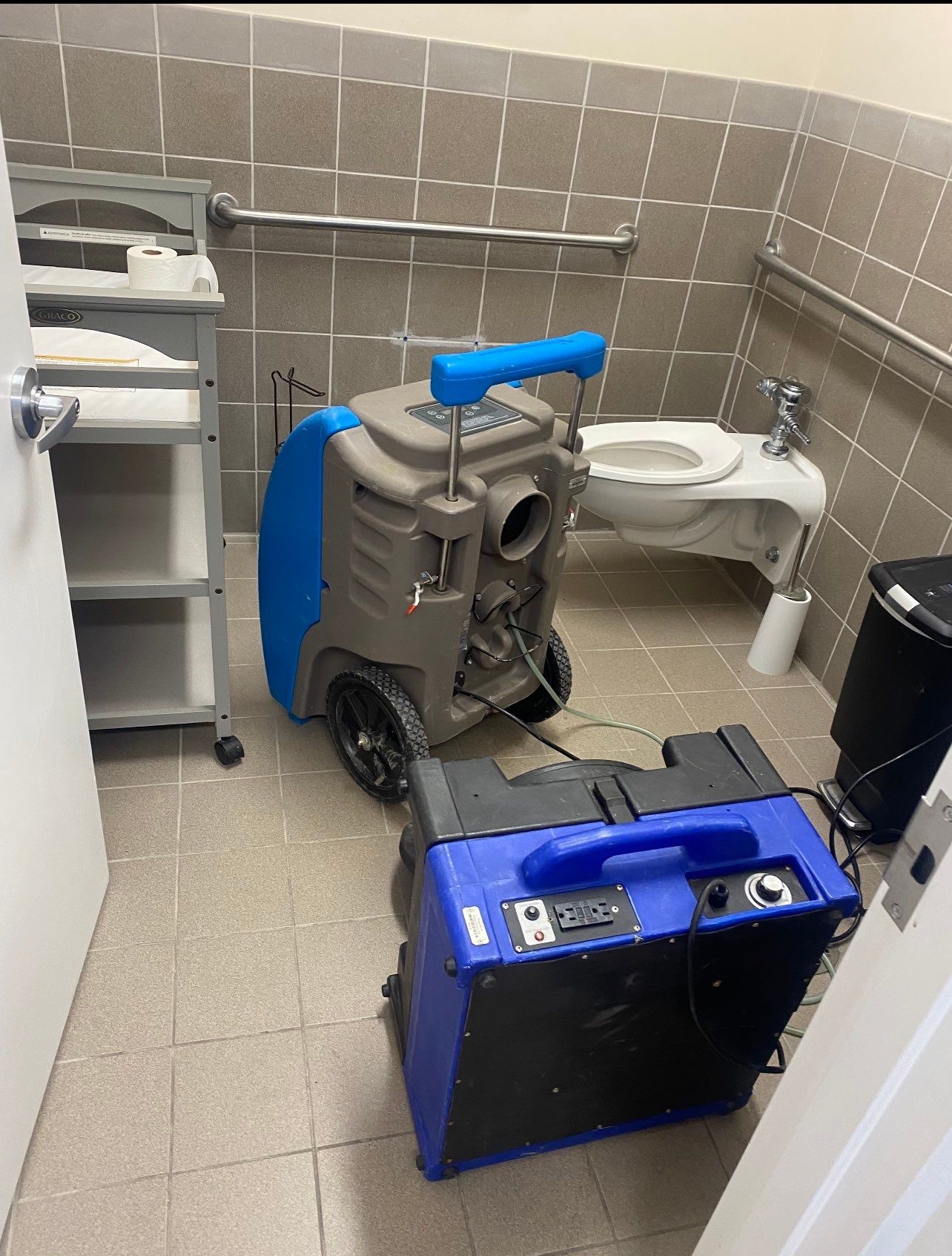 Drying equipment operating throughout the affected area to reduce moisture levels in structural materials.