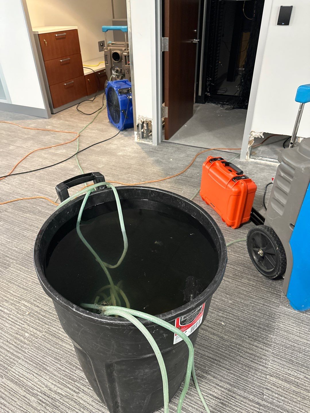 Final-stage water damage restoration in Washington with equipment removal and structural drying nearing completion.