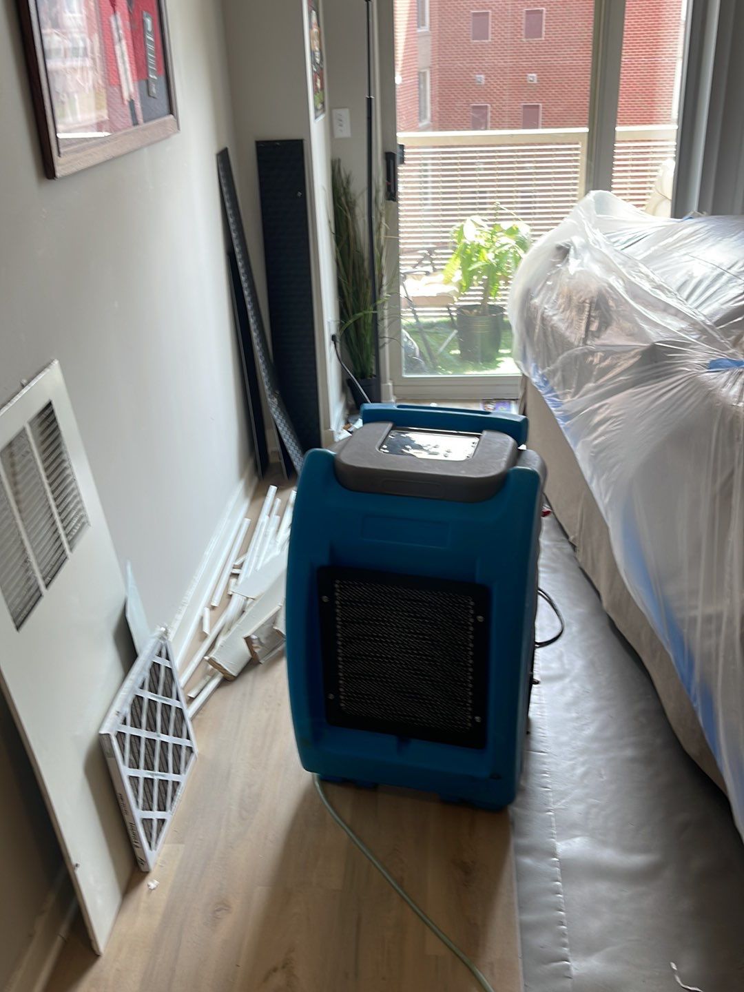 Dehumidifiers and air movers running to complete the drying phase.