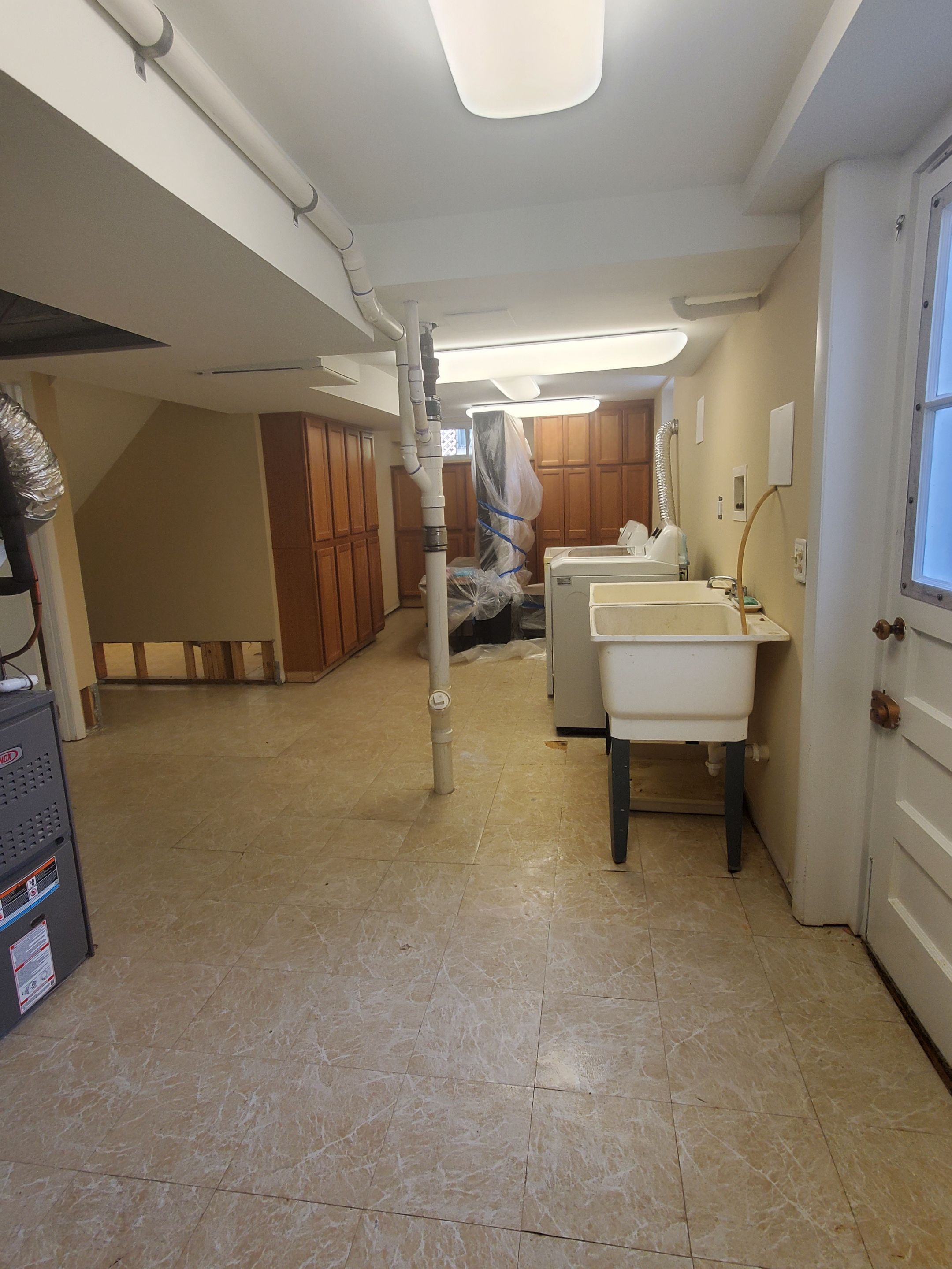 Dehumidification equipment deployed mid-restoration to manage moisture levels across affected interior spaces.