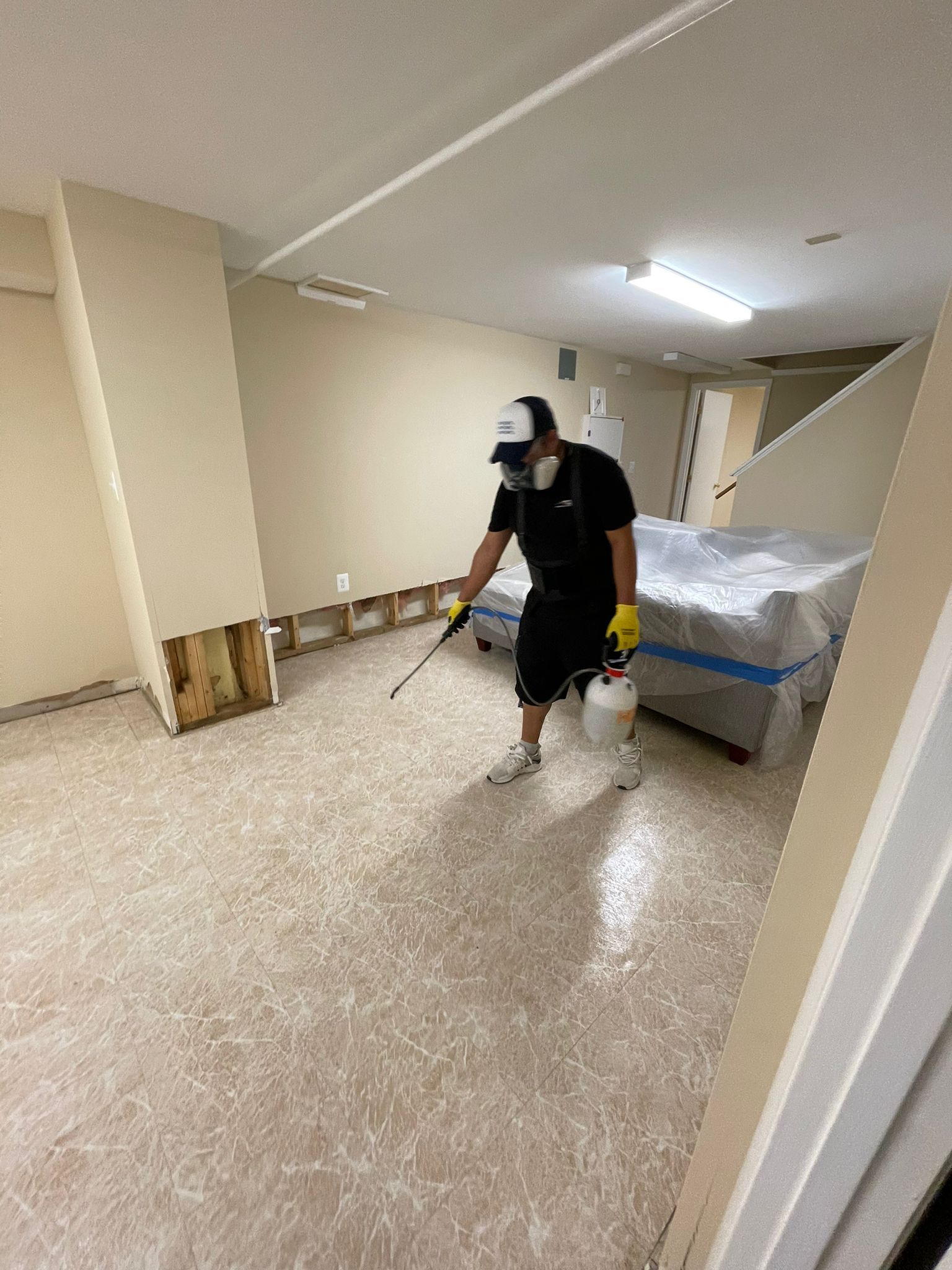 Final-stage water restoration in Silver Spring with equipment removal and structural surfaces approaching dry conditions.