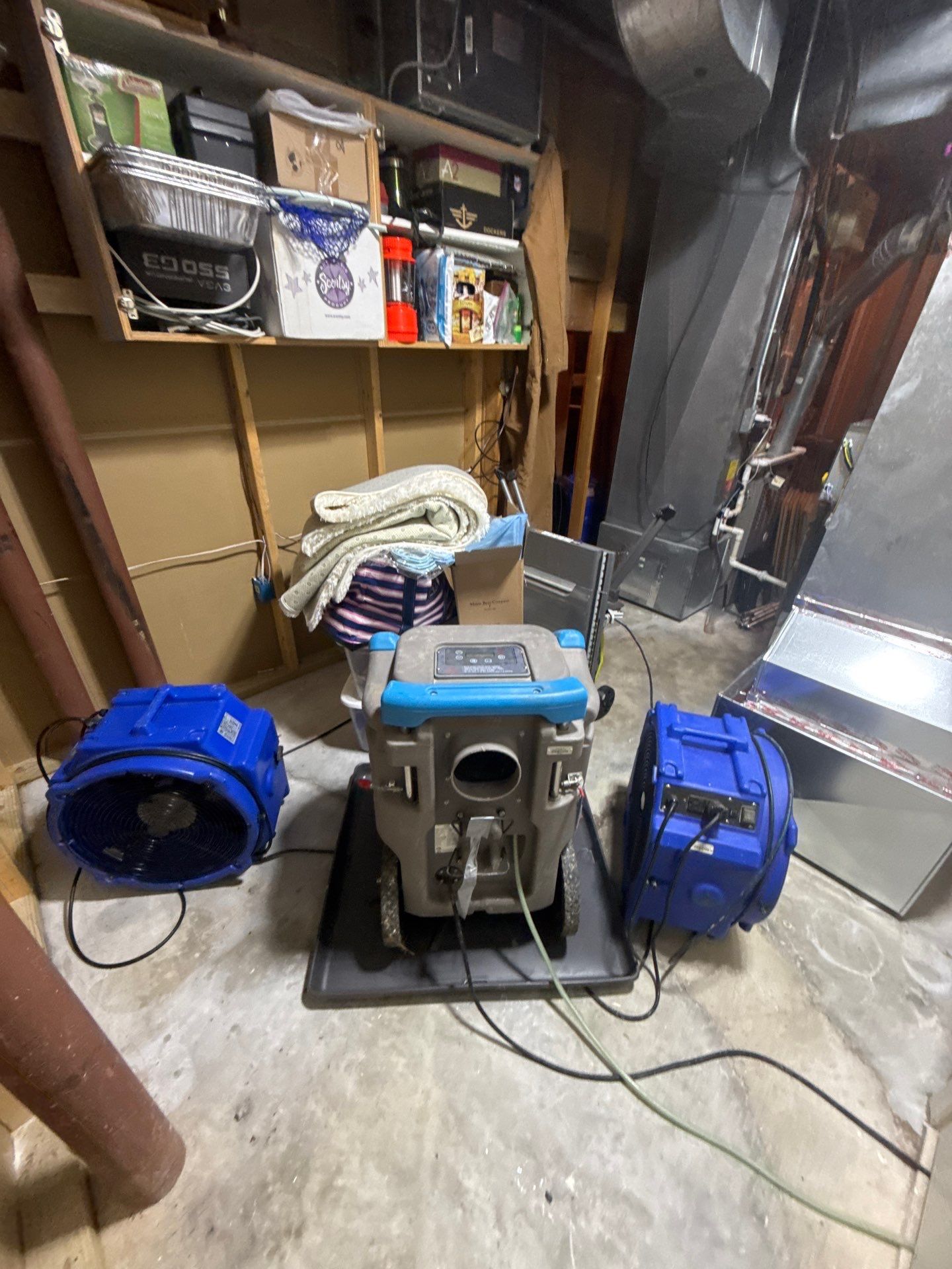 Drying equipment positioned to manage moisture and support structural recovery in ceiling cavity.