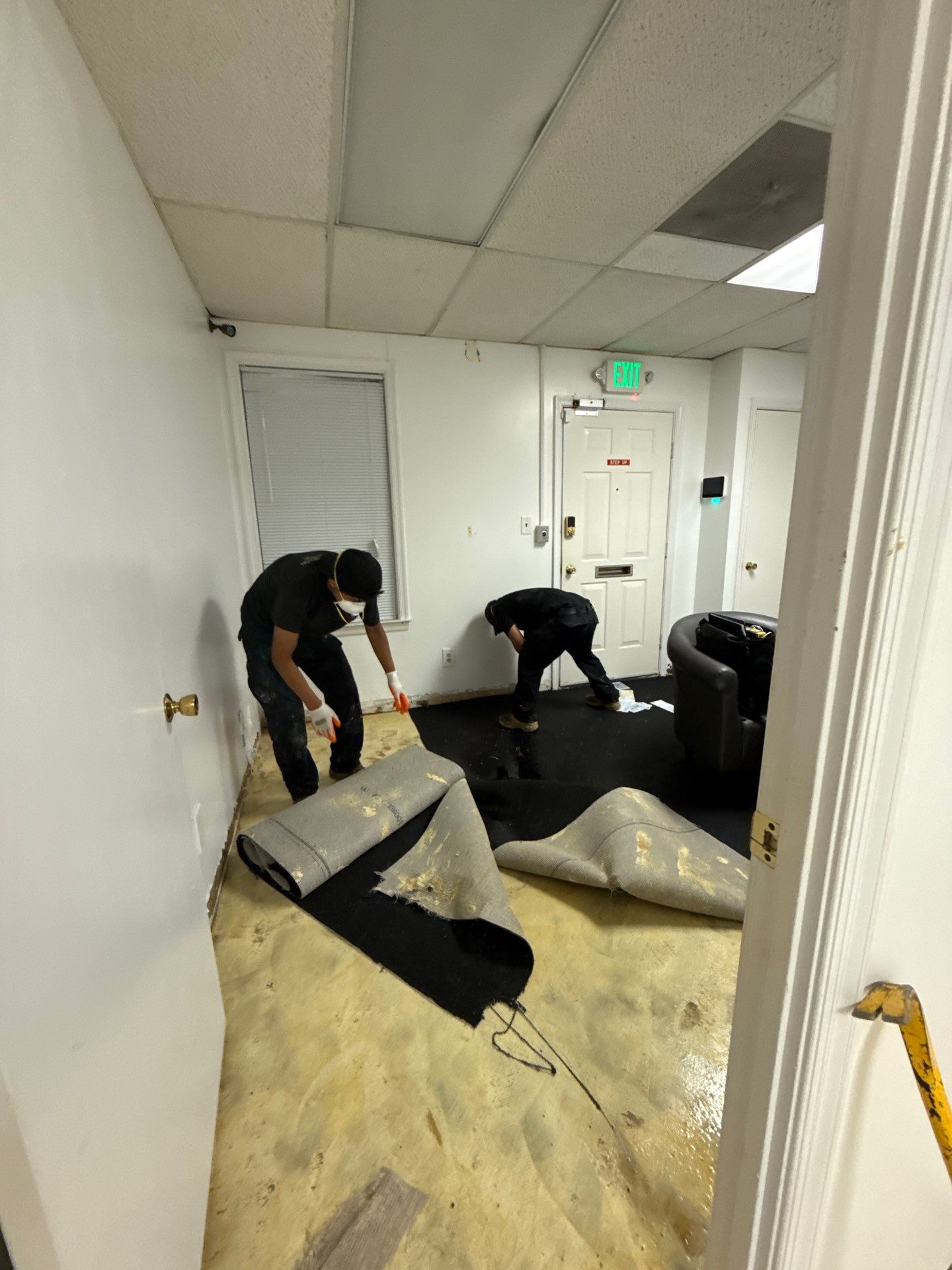 Drying process underway with equipment monitoring moisture levels in Clinton home.