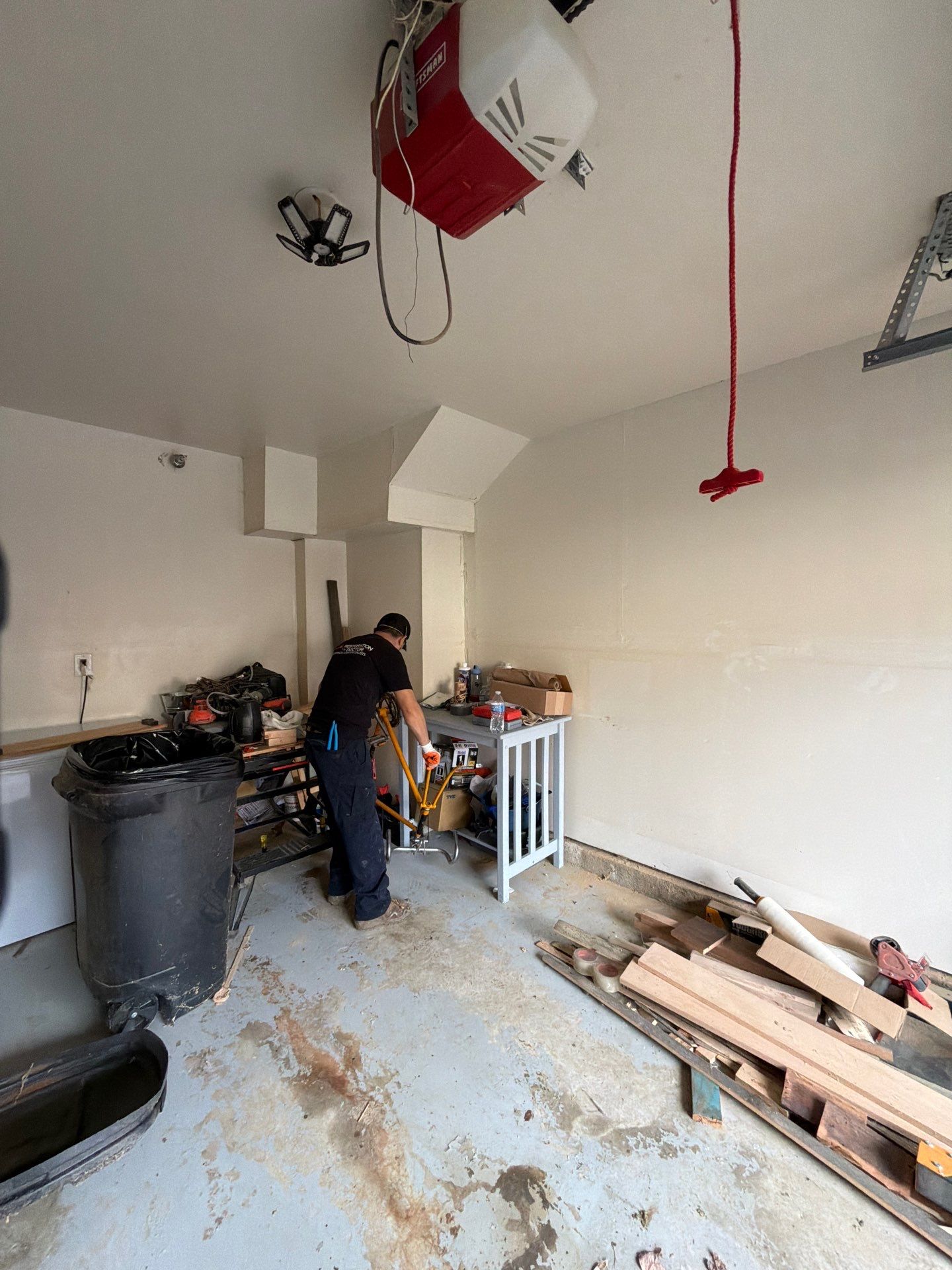 Structural drying equipment positioned to manage moisture after water extraction in remediation sequence.