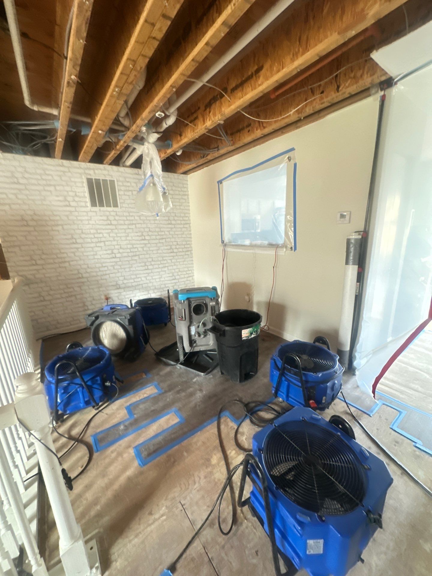 Ceiling damage assessment after water extraction, prior to repair work.