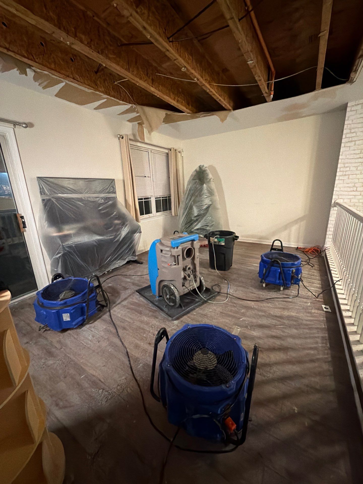 Containment and drying setup maintaining controlled environment during remediation process.